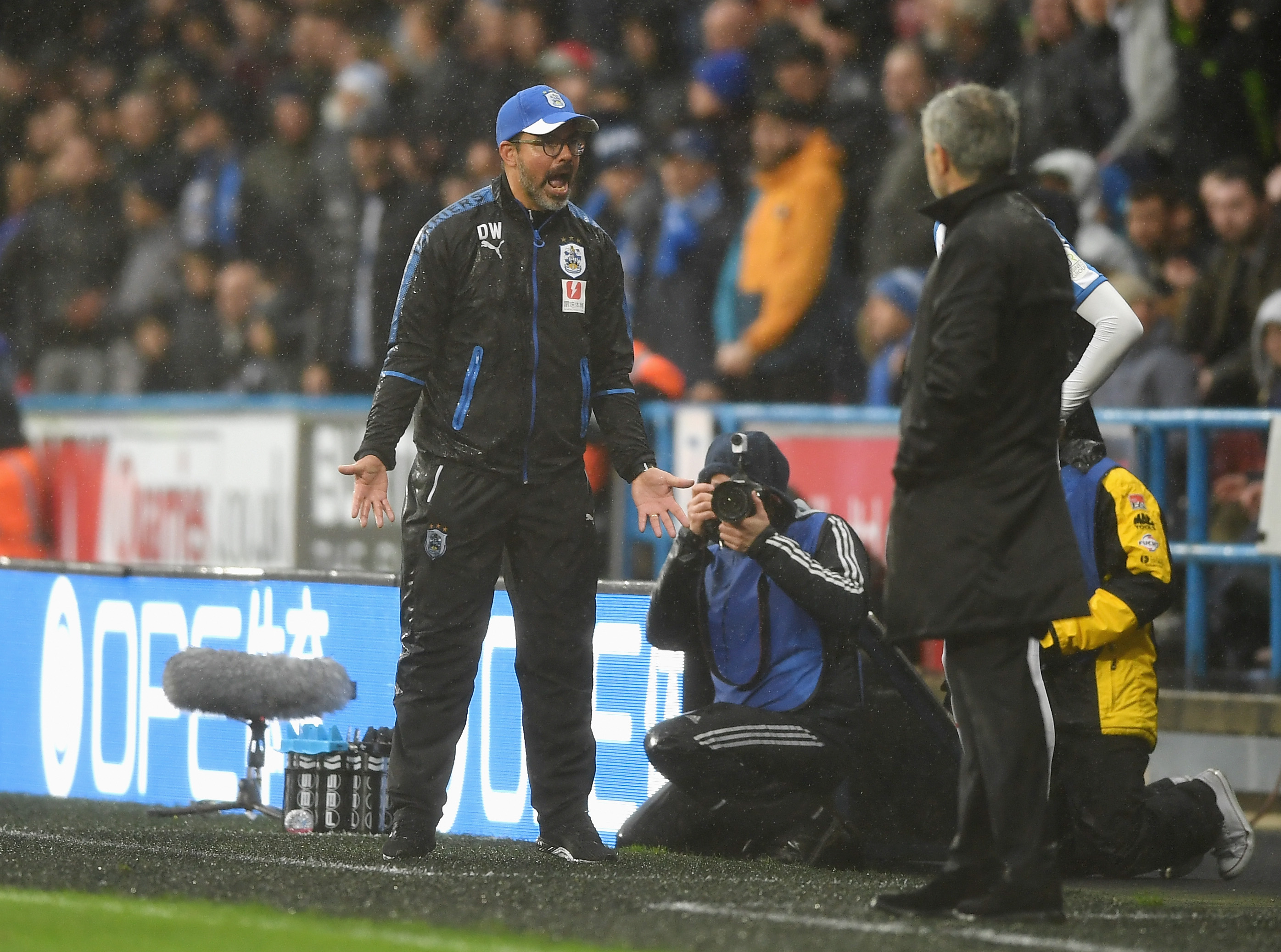 HUDDERSFIELD, ENGLAND - OCTOBER 21:  David Wagner, Manager of Huddersfield Town reacts as Jose Mourinho, Manager of Manchester United looks on during the Premier League match between Huddersfield Town and Manchester United at John Smith's Stadium on October 21, 2017 in Huddersfield, England.  (Photo by Gareth Copley/Getty Images)