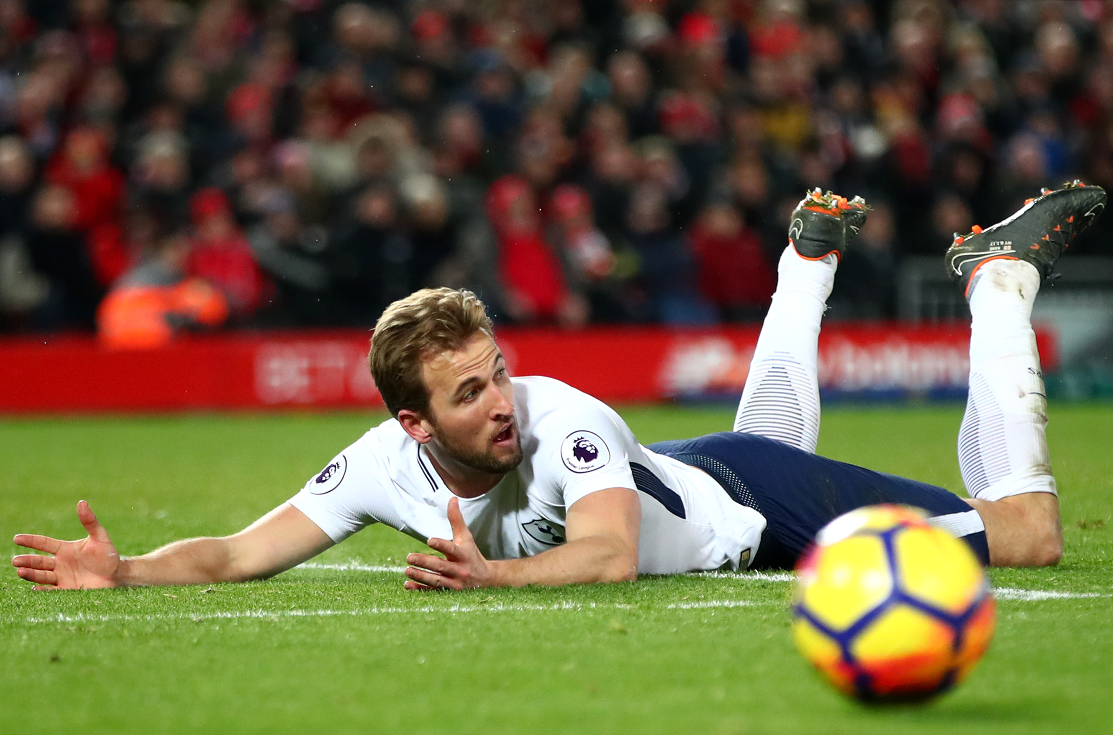 LIVERPOOL, ENGLAND - FEBRUARY 04: Harry Kane of Tottenham Hotspur reacts to being fouled in the penalty area during the Premier League match between Liverpool and Tottenham Hotspur at Anfield on February 4, 2018 in Liverpool, England.  (Photo by Clive Brunskill/Getty Images)