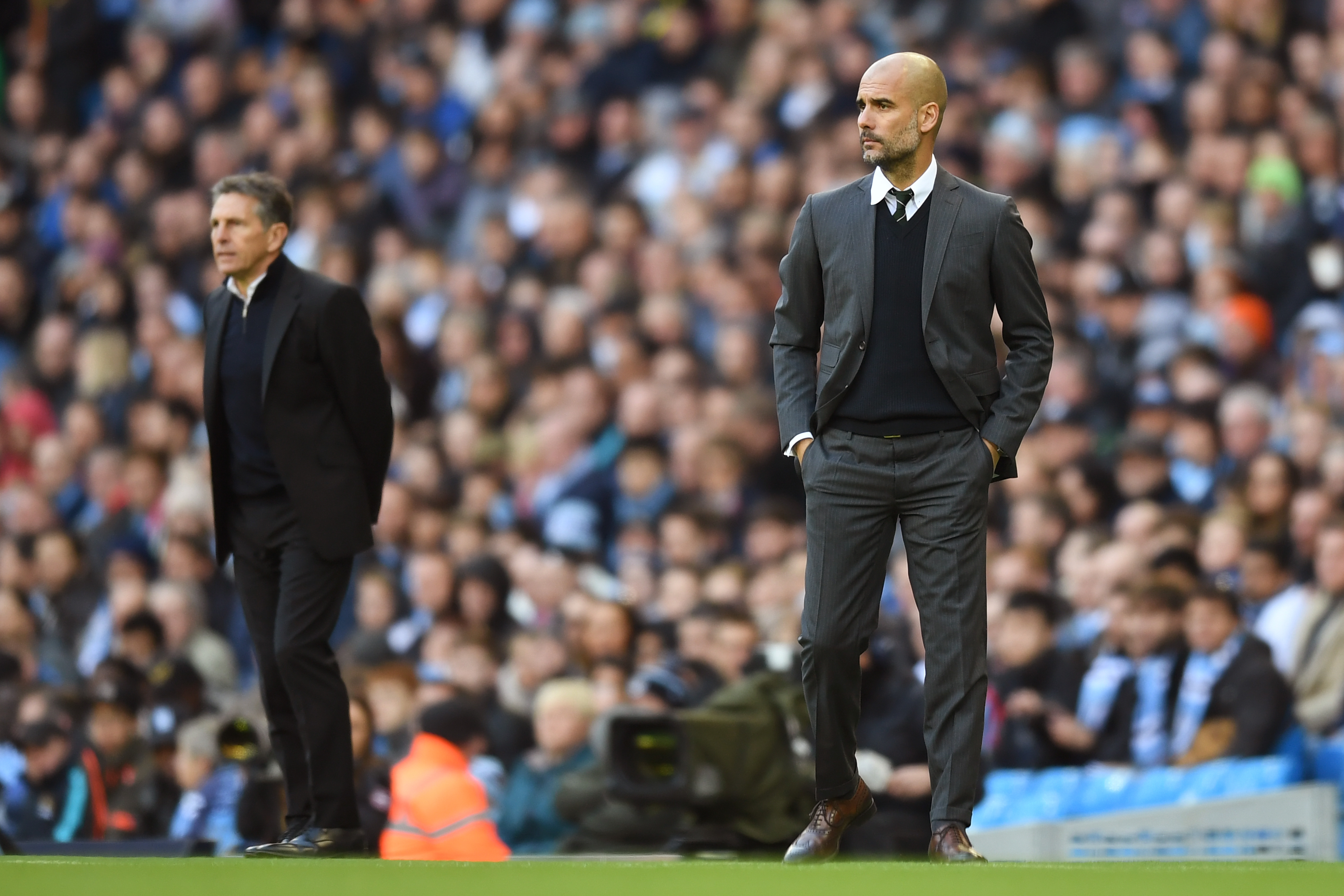 MANCHESTER, ENGLAND - OCTOBER 23:  Josep Guardiola, Manager of Manchester City (R) and Claude Puel, Manager of Southampton (L) look on during the Premier League match between Manchester City and Southampton at Etihad Stadium on October 23, 2016 in Manchester, England.  (Photo by Michael Regan/Getty Images)