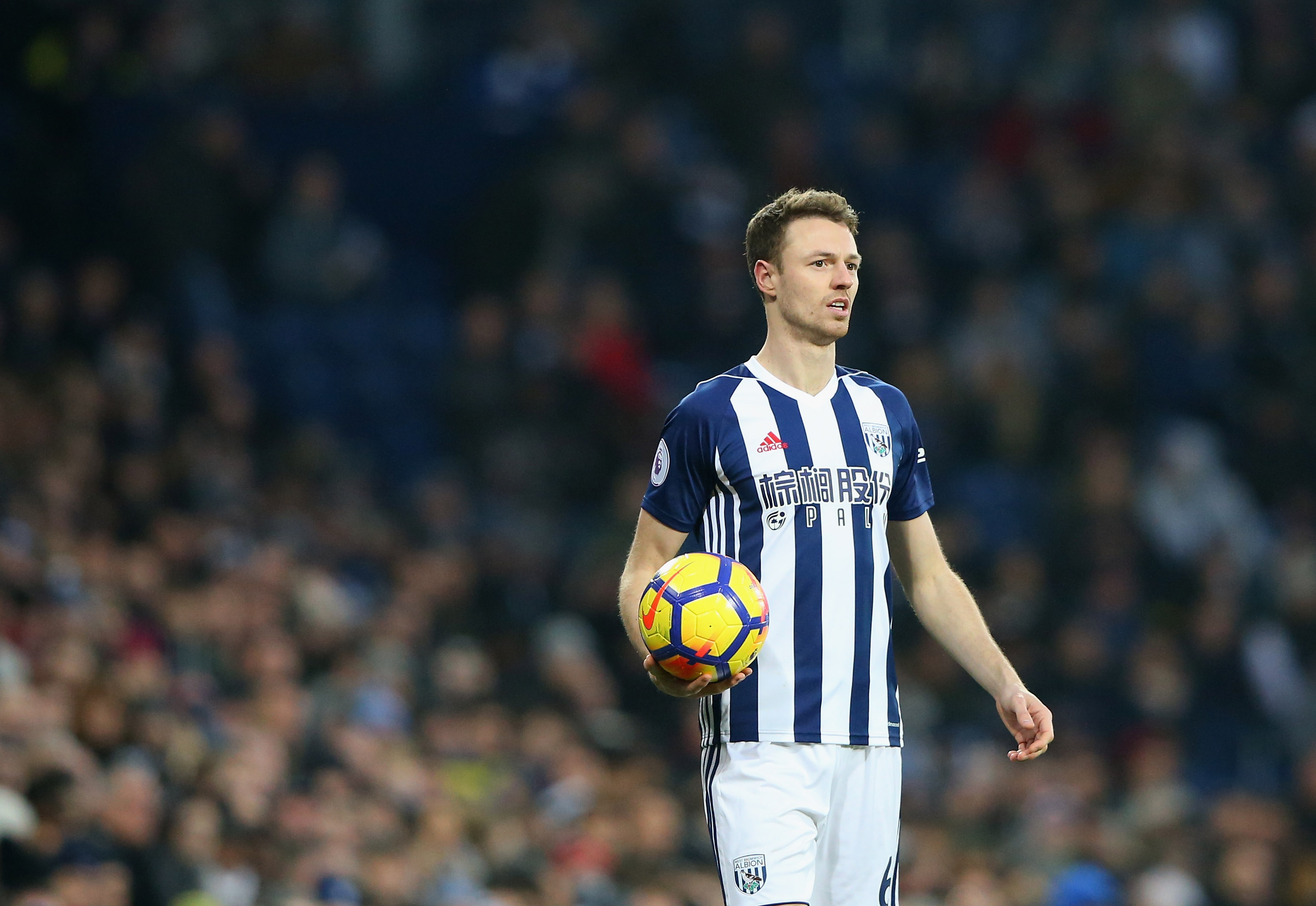 WEST BROMWICH, ENGLAND - JANUARY 13:  Jonny Evans of West Bromwich Albion takes a throw in during the Premier League match between West Bromwich Albion and Brighton and Hove Albion at The Hawthorns on January 13, 2018 in West Bromwich, England.  (Photo by Alex Livesey/Getty Images)