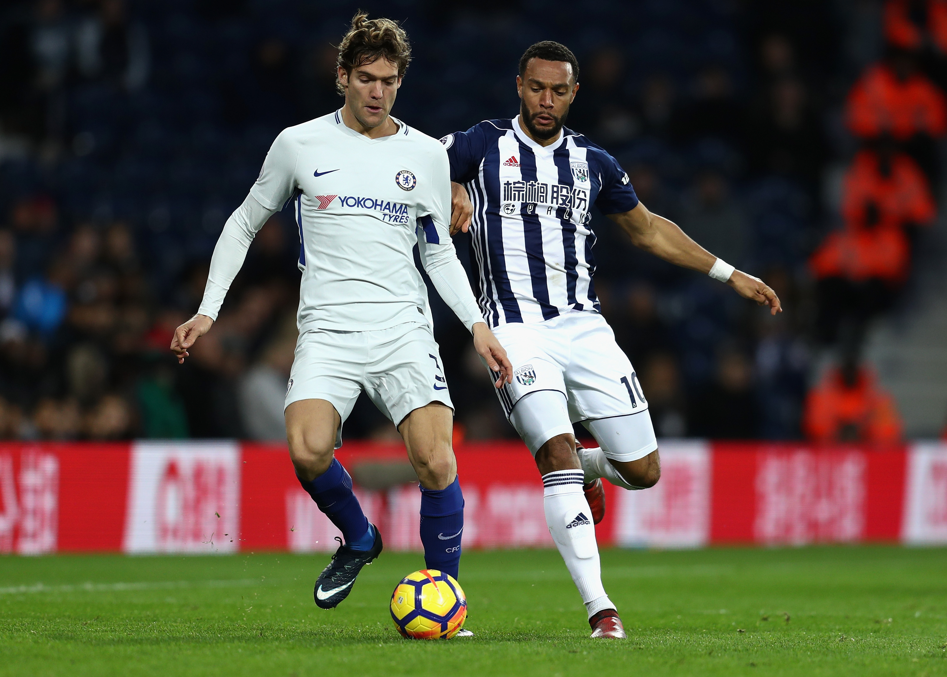 WEST BROMWICH, ENGLAND - NOVEMBER 18:  Marcos Alonso of Chelsea and Matt Phillips of West Bromwich Albion compete for the ball during the Premier League match between West Bromwich Albion and Chelsea at The Hawthorns on November 18, 2017 in West Bromwich, England.  (Photo by Catherine Ivill/Getty Images)