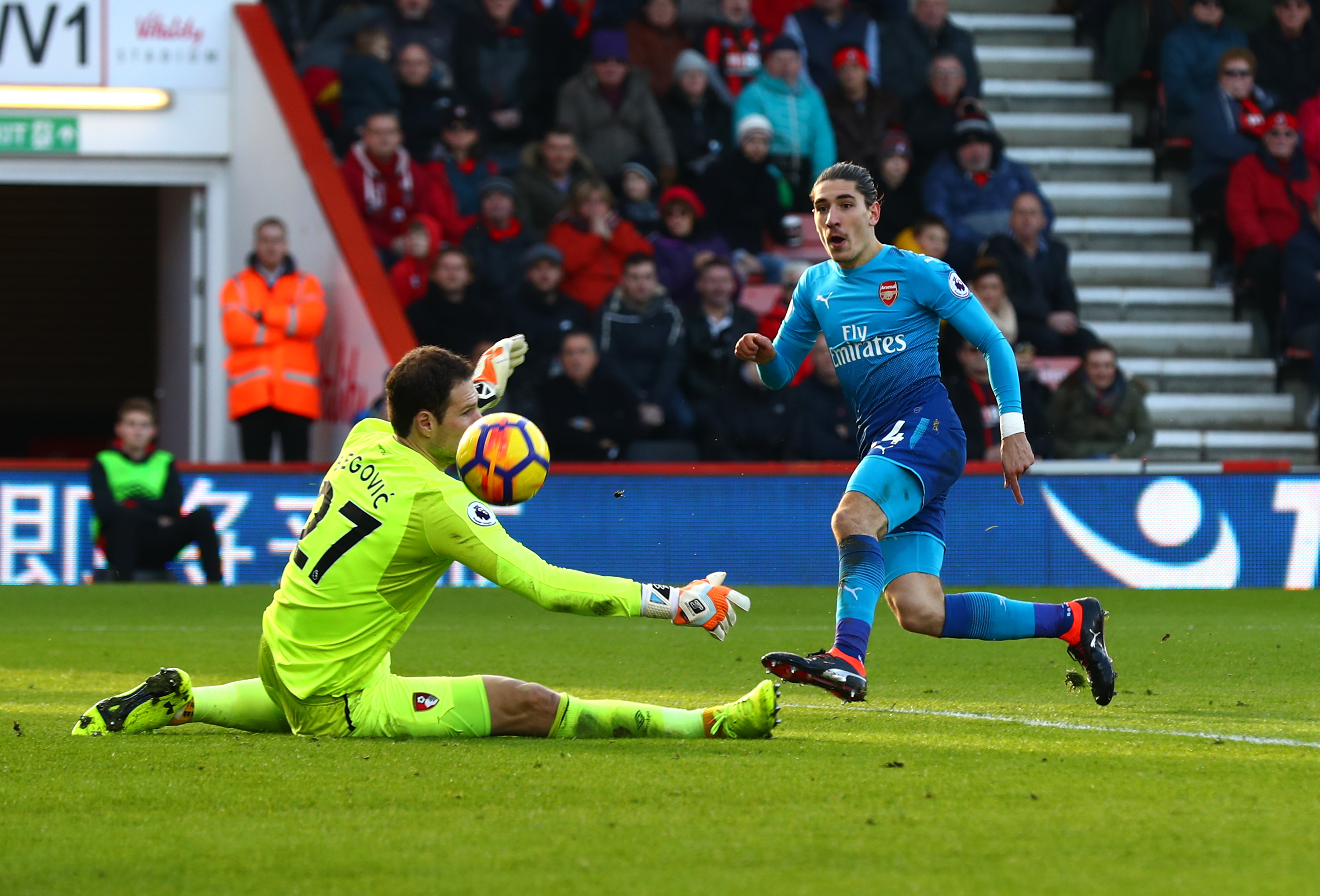 BOURNEMOUTH, ENGLAND - JANUARY 14:  Hector Bellerin of Arsenal scores his sides first goal past Asmir Begovic of AFC Bournemouth during the Premier League match between AFC Bournemouth and Arsenal at Vitality Stadium on January 14, 2018 in Bournemouth, England.  (Photo by Clive Rose/Getty Images)