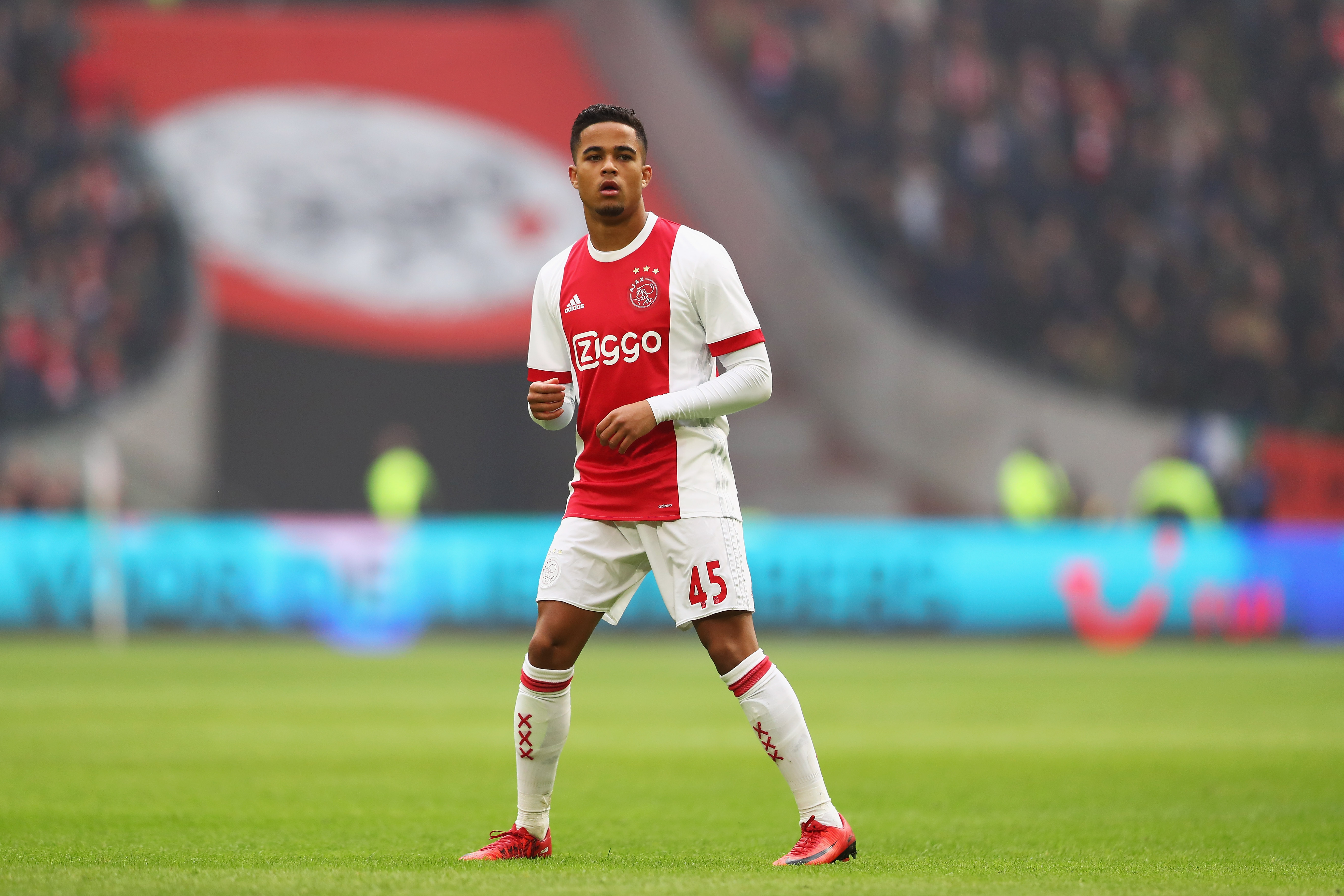 AMSTERDAM, NETHERLANDS - JANUARY 21:  Justin Kluivert of Ajax in action during the Dutch Eredivisie match between Ajax Amsterdam and Feyenoord at Amsterdam ArenA on January 21, 2018 in Amsterdam, Netherlands.  (Photo by Dean Mouhtaropoulos/Getty Images)