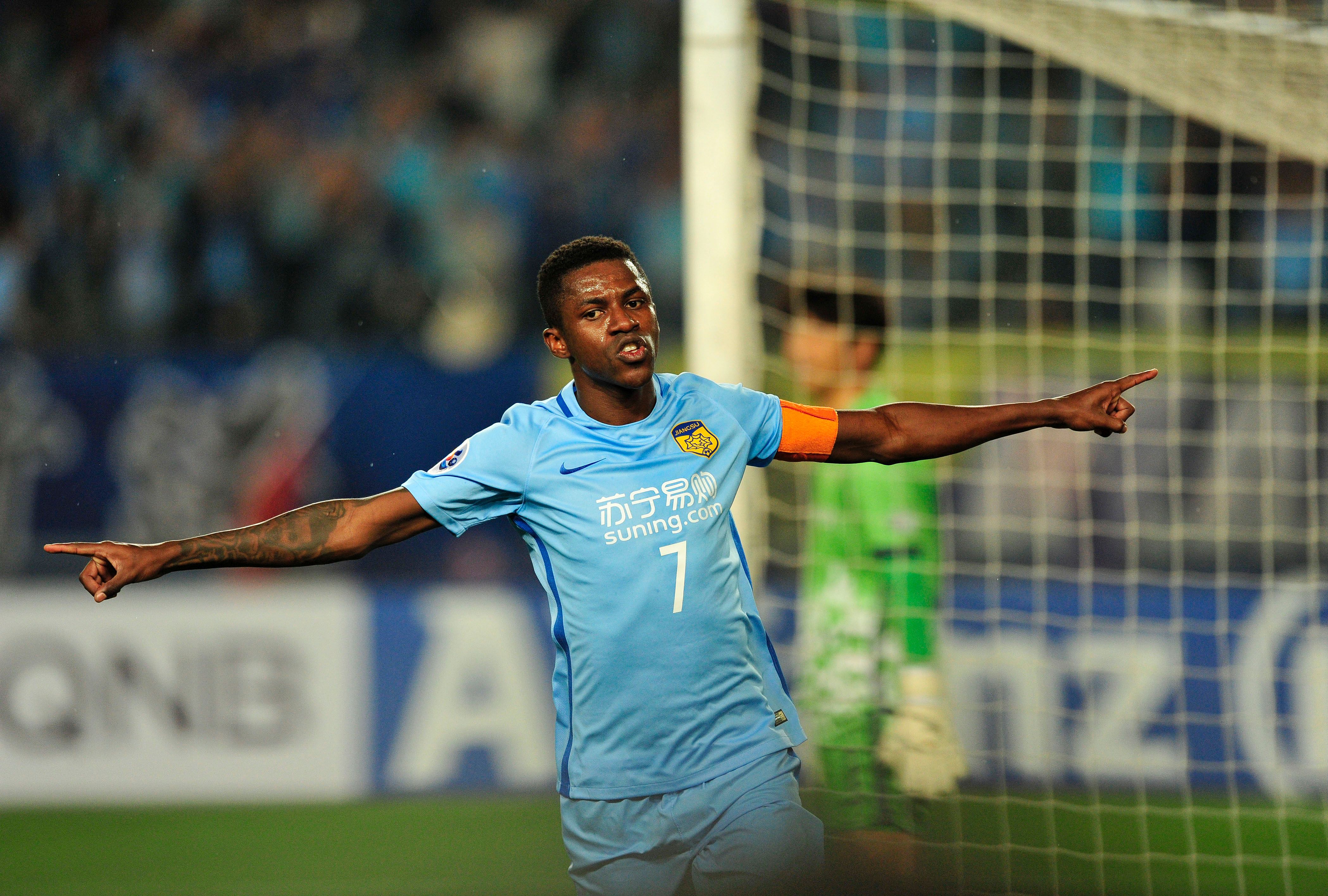 Ramires Santos of Jiangsu FC celebrates after scoring a goal during the AFC Champions League group stage football match against Jeju United FC in Nanjing, east China's Jiangsu province, on April 25, 2017. / AFP PHOTO / STR        (Photo credit should read STR/AFP/Getty Images)