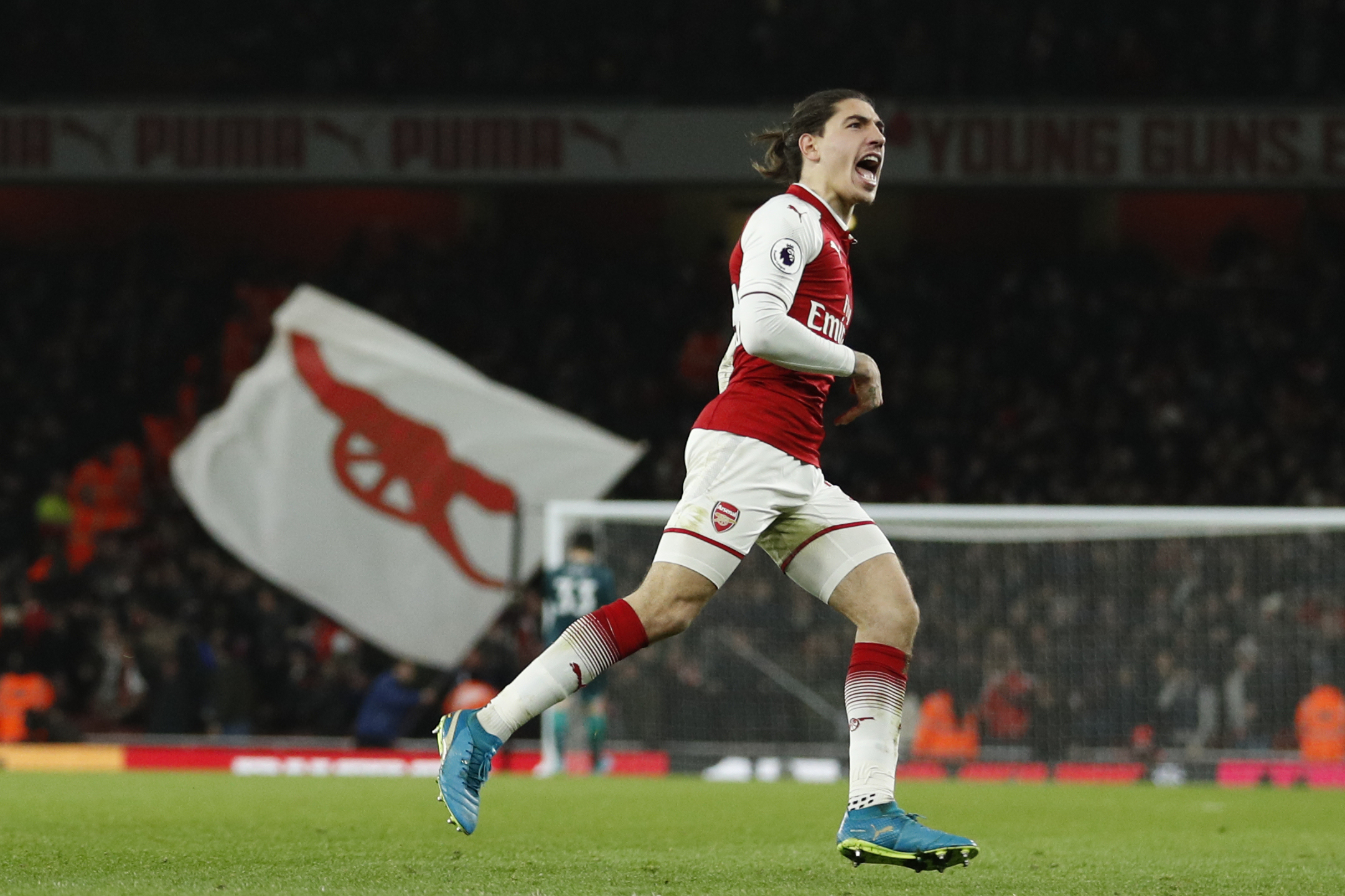 Arsenal's Spanish defender Hector Bellerin celebrates after scoring their second goal during the English Premier League football match between Arsenal and Chelsea at the Emirates Stadium in London on January 3, 2018.  / AFP PHOTO / Adrian DENNIS / RESTRICTED TO EDITORIAL USE. No use with unauthorized audio, video, data, fixture lists, club/league logos or 'live' services. Online in-match use limited to 75 images, no video emulation. No use in betting, games or single club/league/player publications.  /         (Photo credit should read ADRIAN DENNIS/AFP/Getty Images)