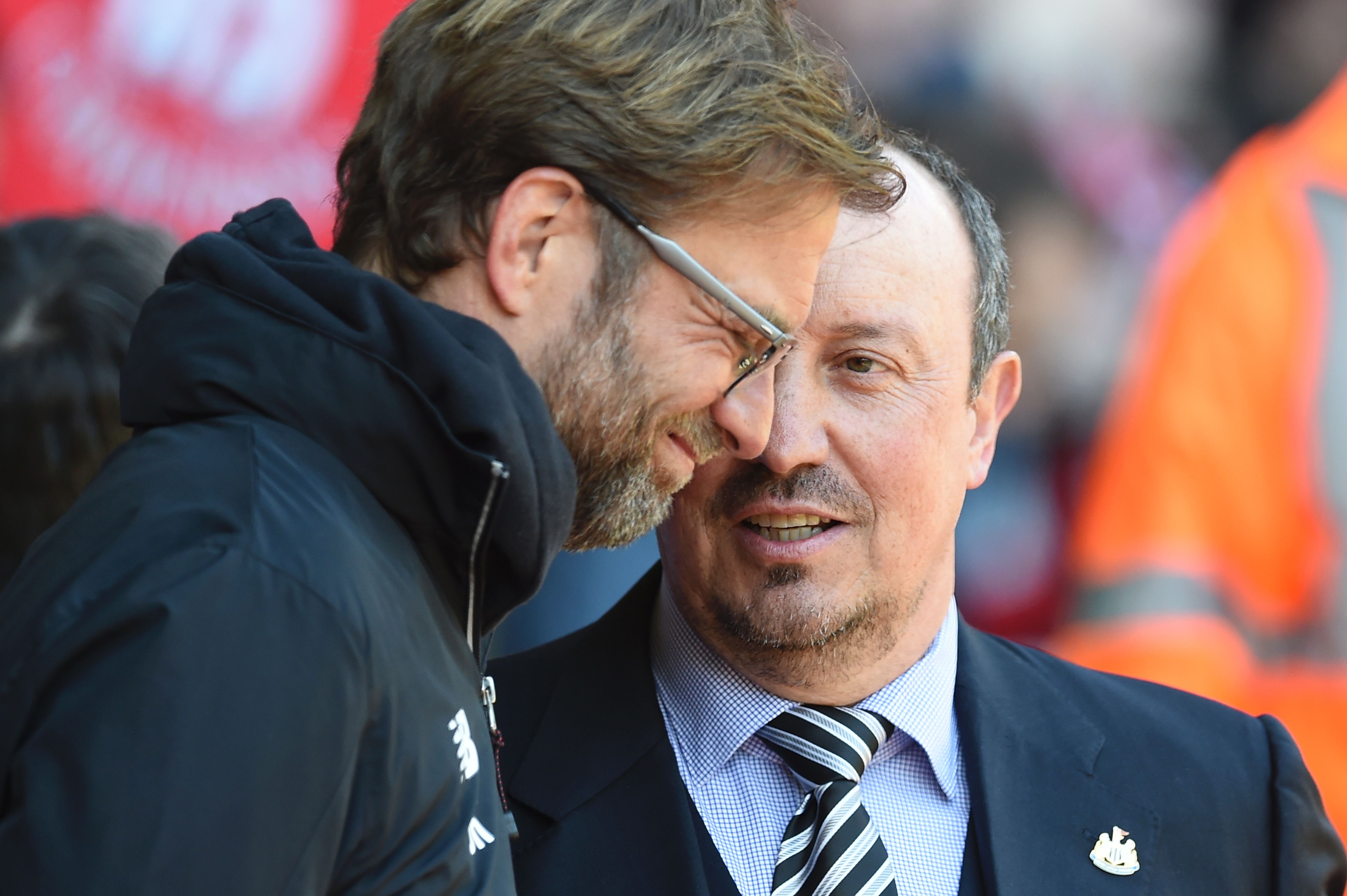 Liverpool's German manager Jurgen Klopp (L) talks with Newcastle United's Spanish manager Rafa Benitez (R) before the English Premier League football match between Liverpool and Newcastle United at Anfield in Liverpool, north west England on April 23, 2016. / AFP / PAUL ELLIS / RESTRICTED TO EDITORIAL USE. No use with unauthorized audio, video, data, fixture lists, club/league logos or 'live' services. Online in-match use limited to 75 images, no video emulation. No use in betting, games or single club/league/player publications.  /         (Photo credit should read PAUL ELLIS/AFP/Getty Images)