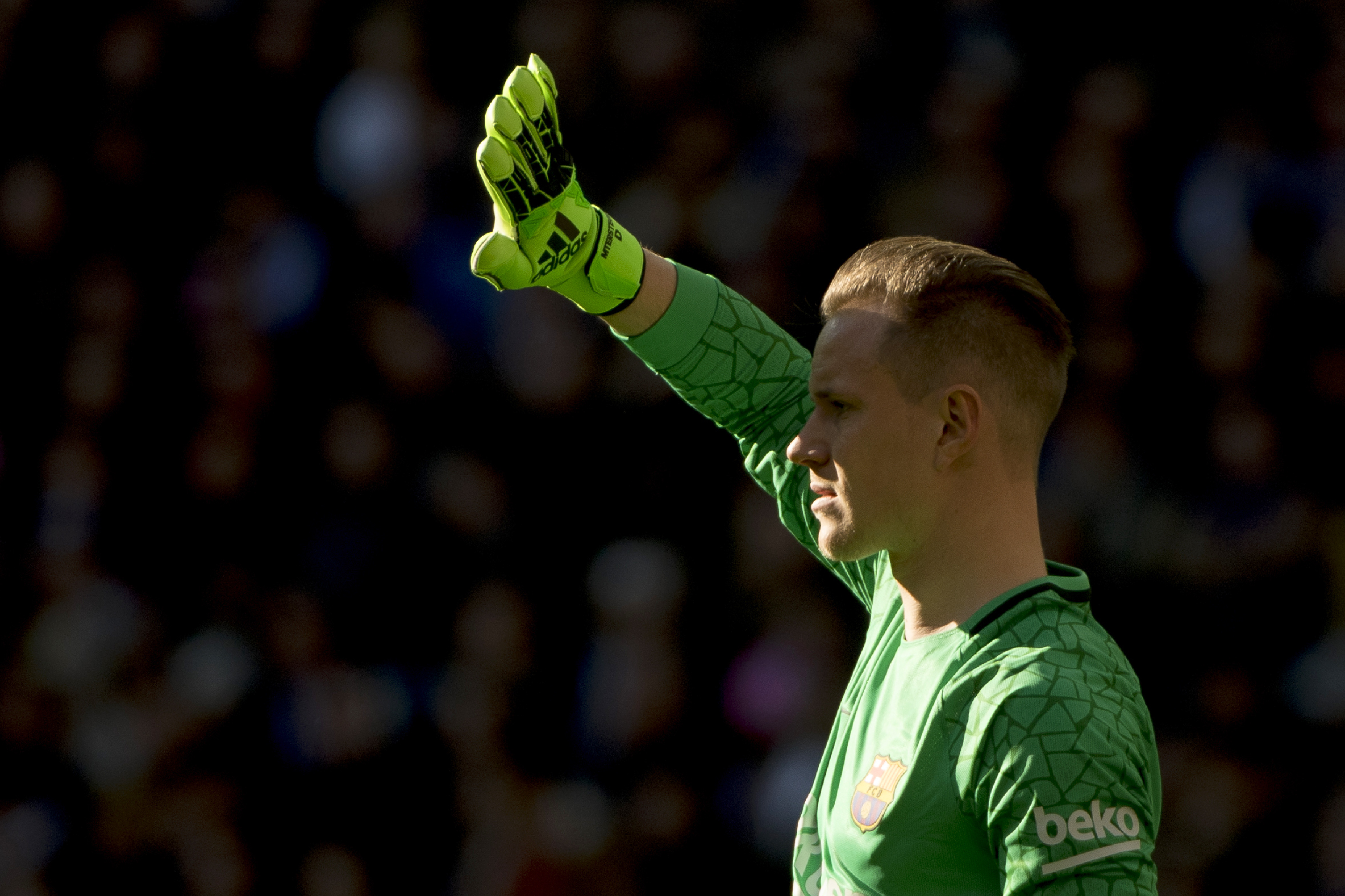 Barcelona's German goalkeeper Marc-Andre Ter Stegen looks on during the Spanish League "Clasico" football match Real Madrid CF vs FC Barcelona at the Santiago Bernabeu stadium in Madrid on December 23, 2017.  / AFP PHOTO / CURTO DE LA TORRE        (Photo credit should read CURTO DE LA TORRE/AFP/Getty Images)