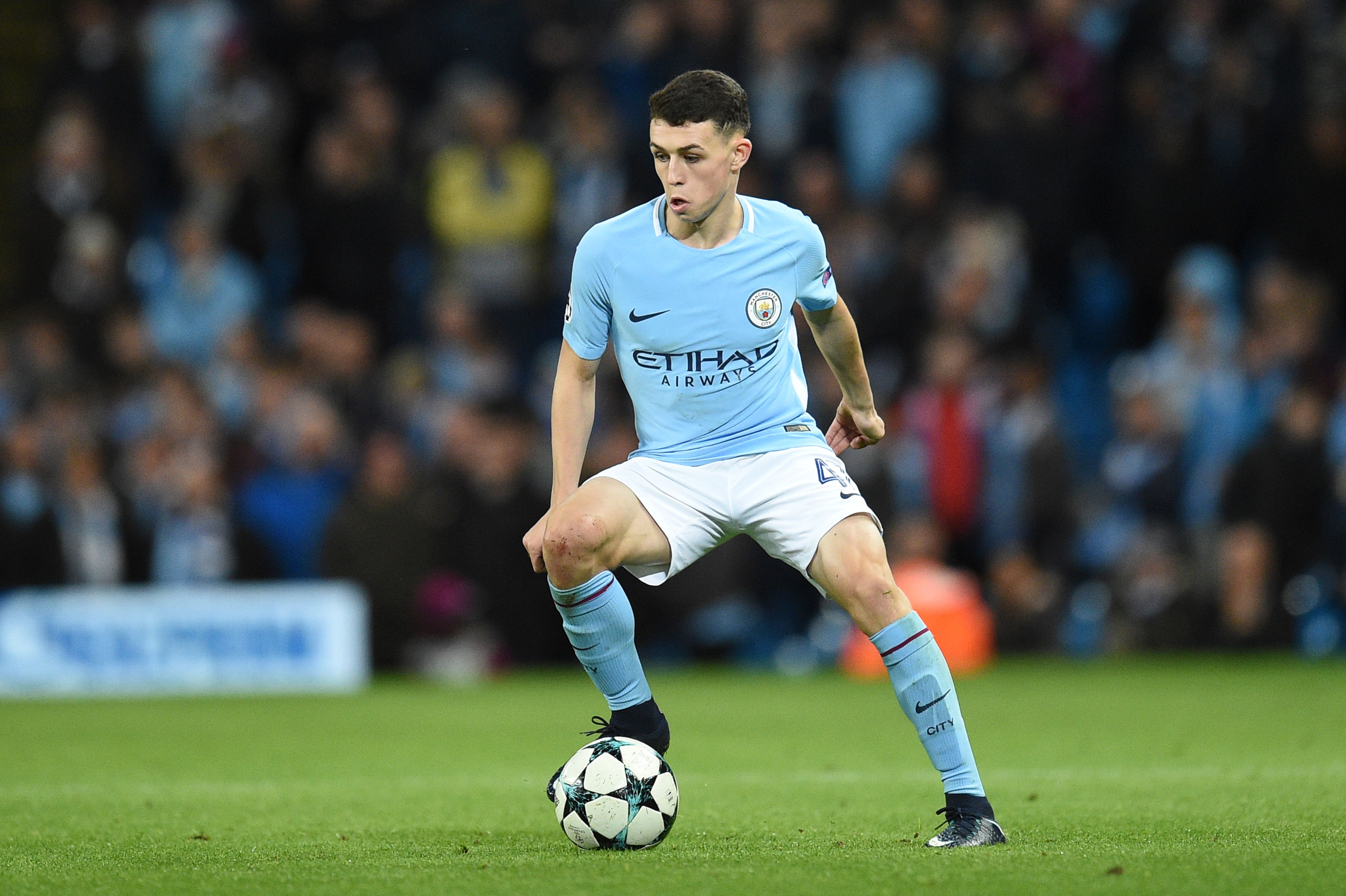 Manchester City's English midfielder Phil Foden controls the ball during the UEFA Champions League Group F football match between Manchester City and Feyenoord at the Etihad Stadium in Manchester, north west England, on November 21, 2017. / AFP PHOTO / Oli SCARFF        (Photo credit should read OLI SCARFF/AFP/Getty Images)