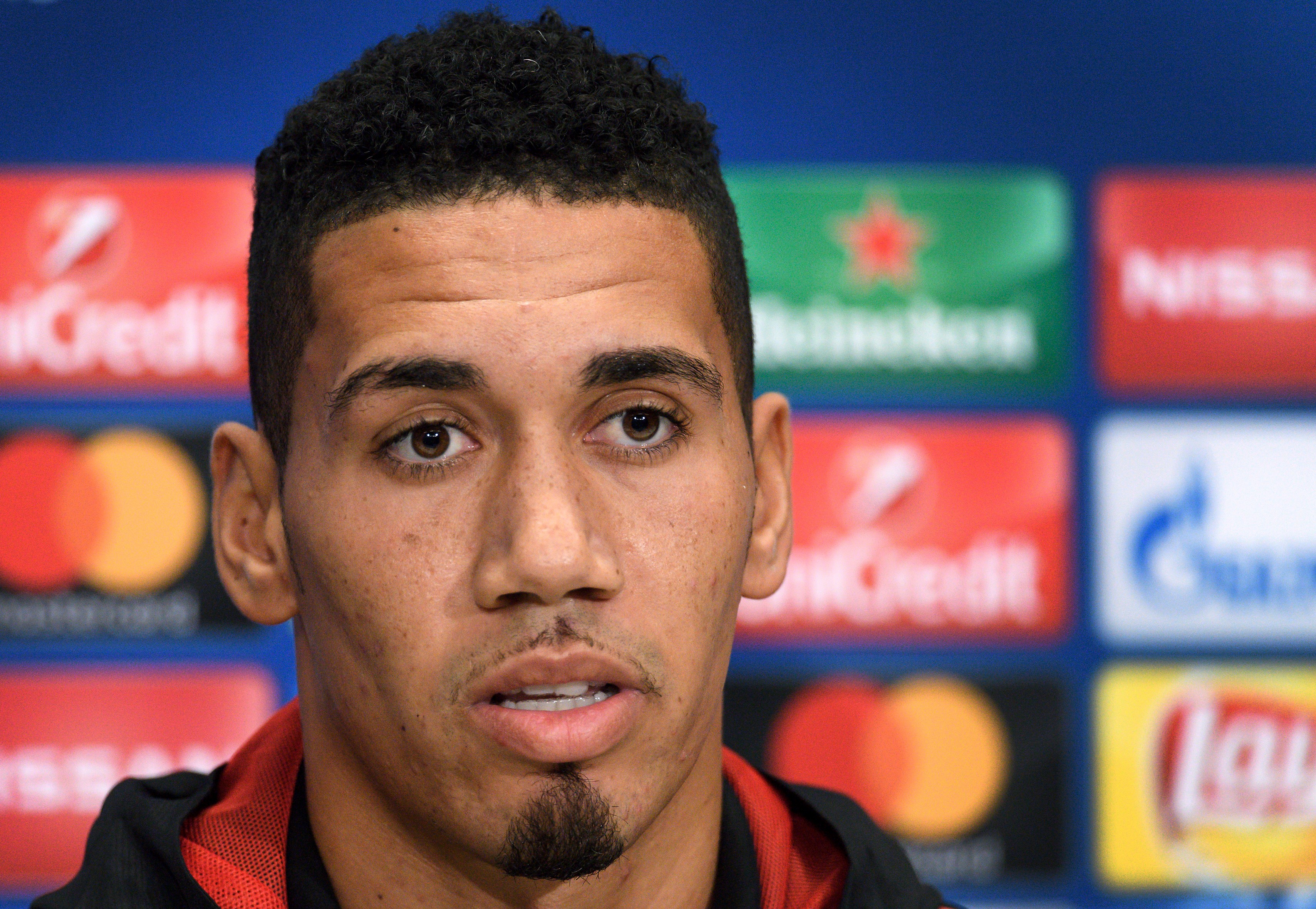 Manchester United's English defender Chris Smalling attends a press conference on the eve of the UEFA Champions League Group A football match between FC Basel and Manchester United on November 21, 2017 in Basel. / AFP PHOTO / Fabrice COFFRINI        (Photo credit should read FABRICE COFFRINI/AFP/Getty Images)