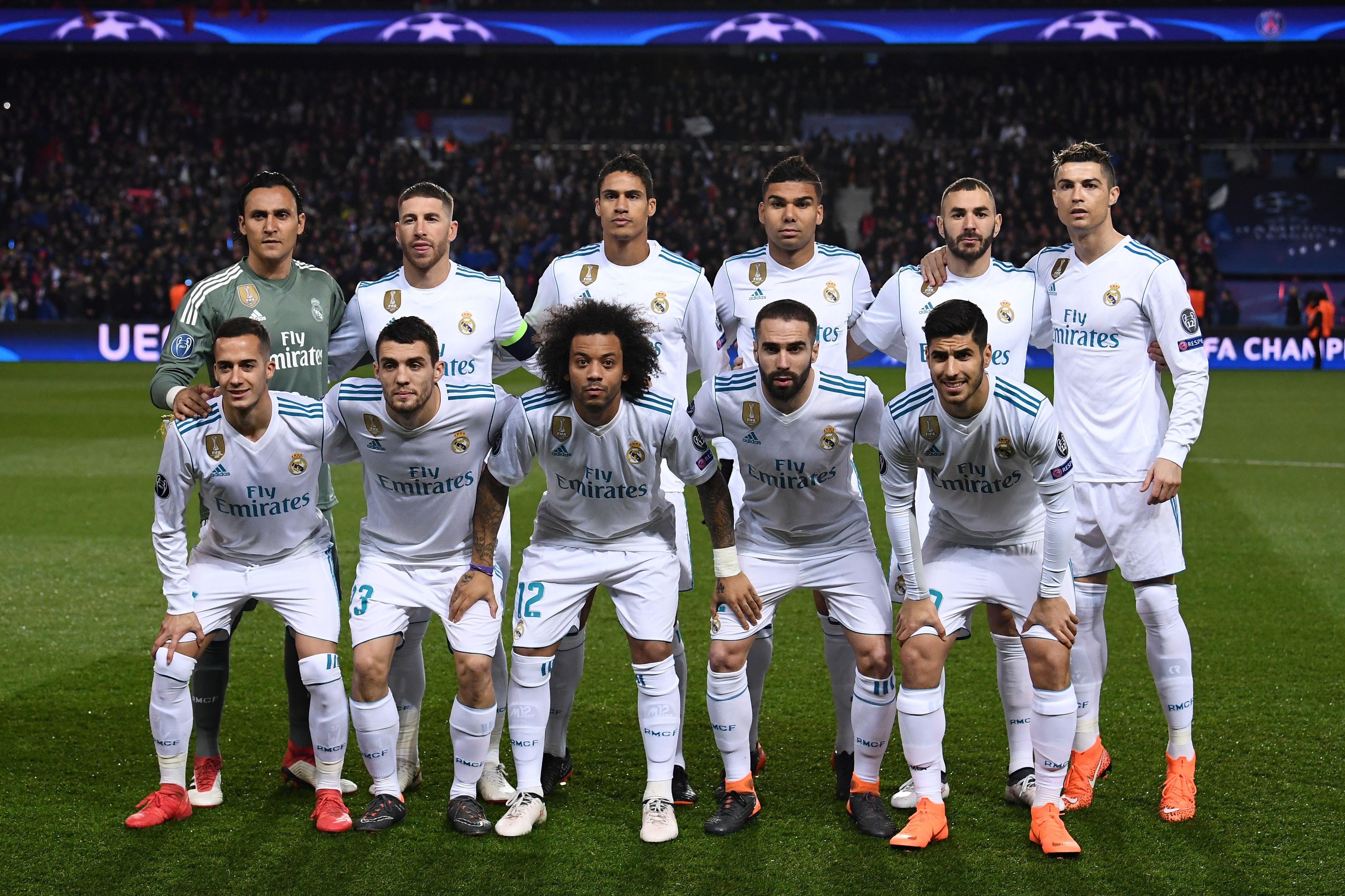 (Top L-R) Real Madrid's Costa Rican goalkeeper Keylor Navas,  Spanish defender Sergio Ramos, French defender Raphael Varane,  Brazilian midfielder Casemiro, French forward Karim Benzema, Portuguese forward Cristiano Ronaldo, (Bottom L-R)  Spanish midfielder Lucas Vazquez,  Croatian midfielder Mateo Kovacic, Brazilian defender Marcelo,  Spanish defender Dani Carvajal and  Spanish midfielder Marco Asensio pose prior to the UEFA Champions League round of 16 second leg football match between Paris Saint-Germain (PSG) and Real Madrid on March 6, 2018, at the Parc des Princes stadium in Paris. / AFP PHOTO / FRANCK FIFE        (Photo credit should read FRANCK FIFE/AFP/Getty Images)