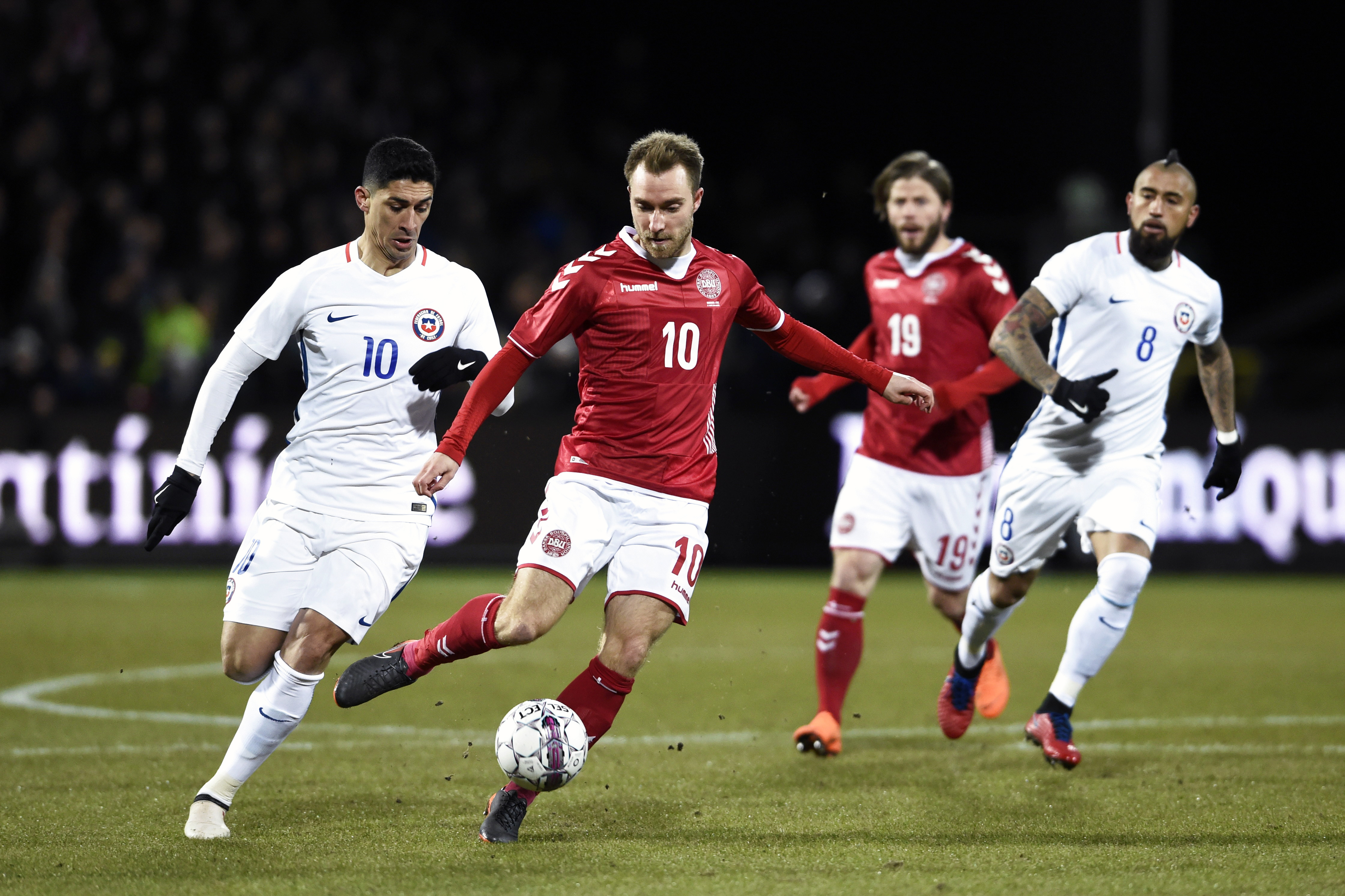 Denmark's Christian Eriksen (2L) and Chile's Pedro Pablo Hernandez vie for the ball during their international friendly football match between Denmark and Chile in Aalborg, Denmark on March 27, 2018. / AFP PHOTO / Ritzau Scanpix AND Scanpix / Henning Bagger / Denmark OUT        (Photo credit should read HENNING BAGGER/AFP/Getty Images)