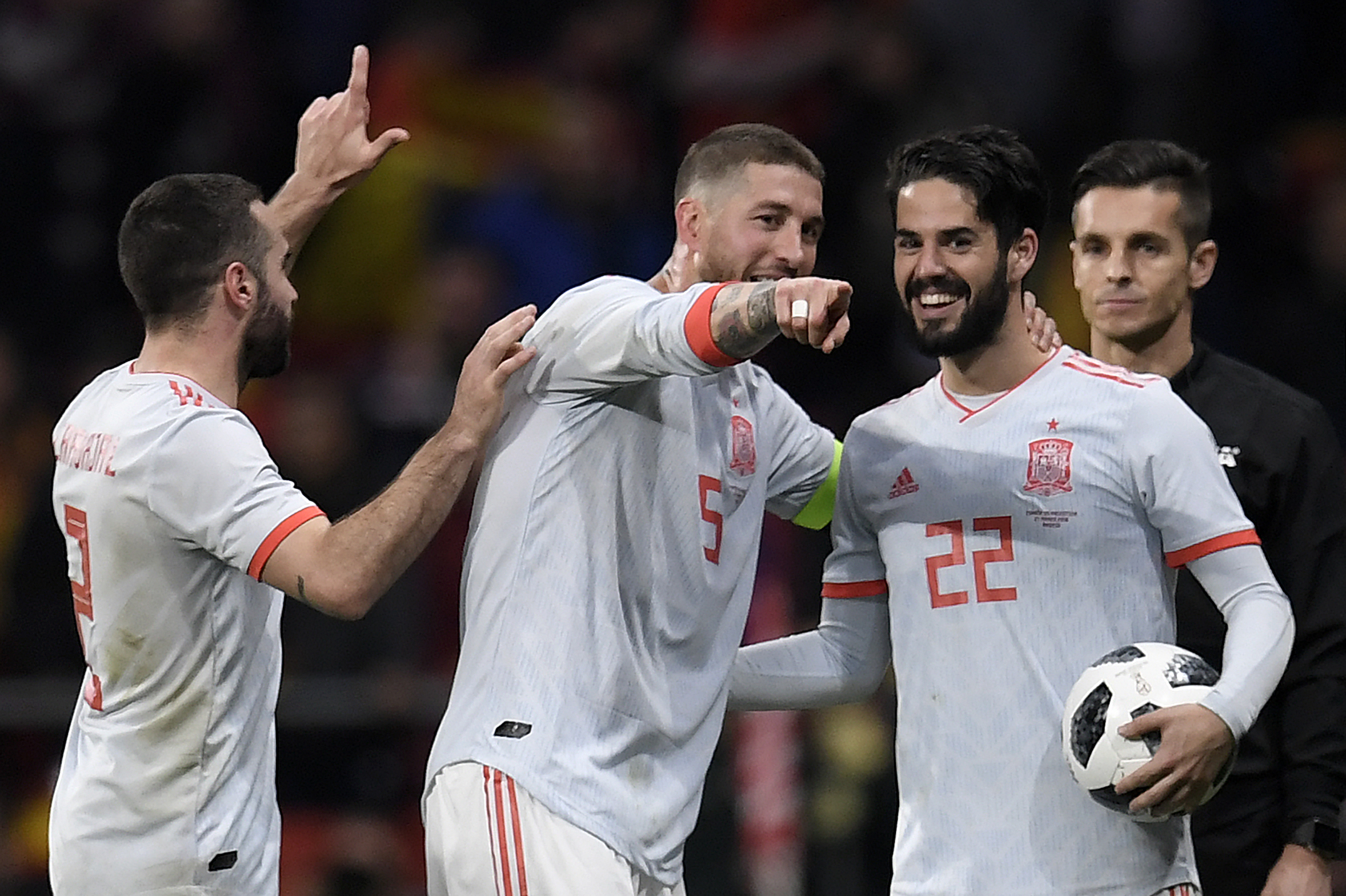 Spain's defender Dani Carvajal, Spain's defender Sergio Ramos and Spain's midfielder Isco celebrate after a friendly football match between Spain and Argentina at the Wanda Metropolitano Stadium in Madrid on March 27, 2018. / AFP PHOTO / GABRIEL BOUYS        (Photo credit should read GABRIEL BOUYS/AFP/Getty Images)