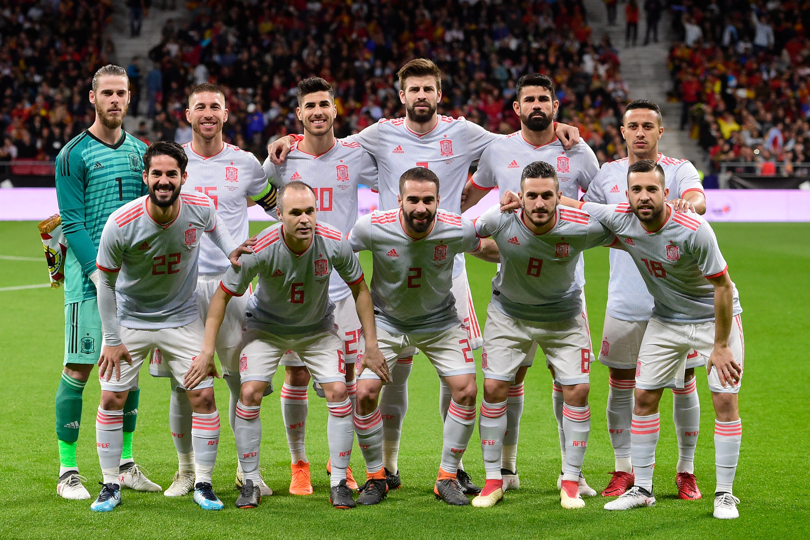 (Back L-R) Spain's goalkeeper David de Gea, Spain's defender Sergio Ramos, Spain's midfielder Marco Asensio, Spain's defender Gerard Pique, Spain's forward Diego Costa, Spain's midfielder Thiago, (L-R) Spain's midfielder Isco, Spain's midfielder Andres Iniesta, Spain's defender Dani Carvajal, Spain's midfielder Koke and Spain's defender Jordi Alba pose for a group picture before a friendly football match between Spain and Argentina at the Wanda Metropolitano Stadium in Madrid on March 27, 2018. / AFP PHOTO / PIERRE-PHILIPPE MARCOU        (Photo credit should read PIERRE-PHILIPPE MARCOU/AFP/Getty Images)
