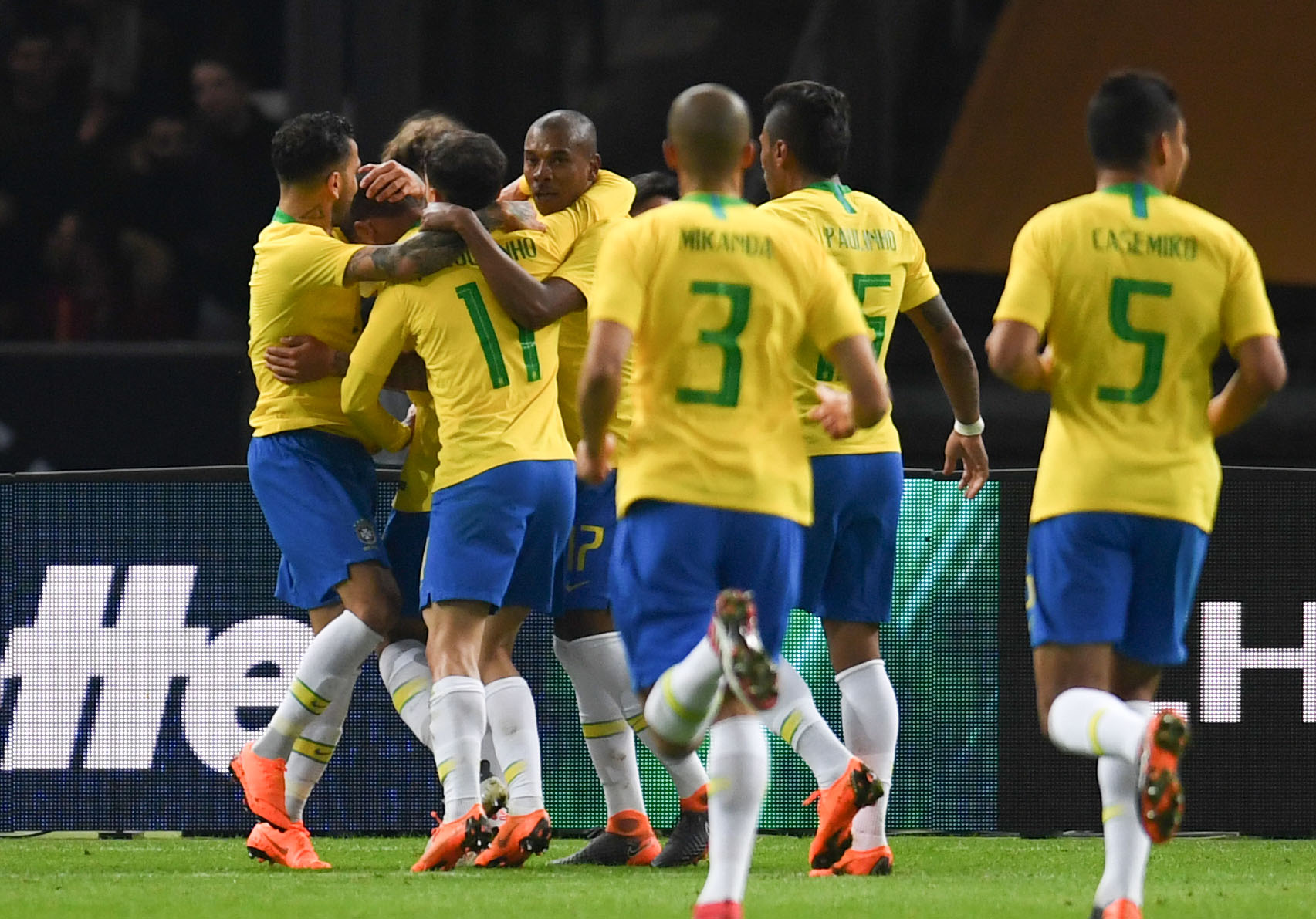 Brazil's players celebrate after scoring the opening goal during their international friendly football match between Germany and Brazil in Berlin, on March 27, 2018. / AFP PHOTO / Patrik STOLLARZ        (Photo credit should read PATRIK STOLLARZ/AFP/Getty Images)