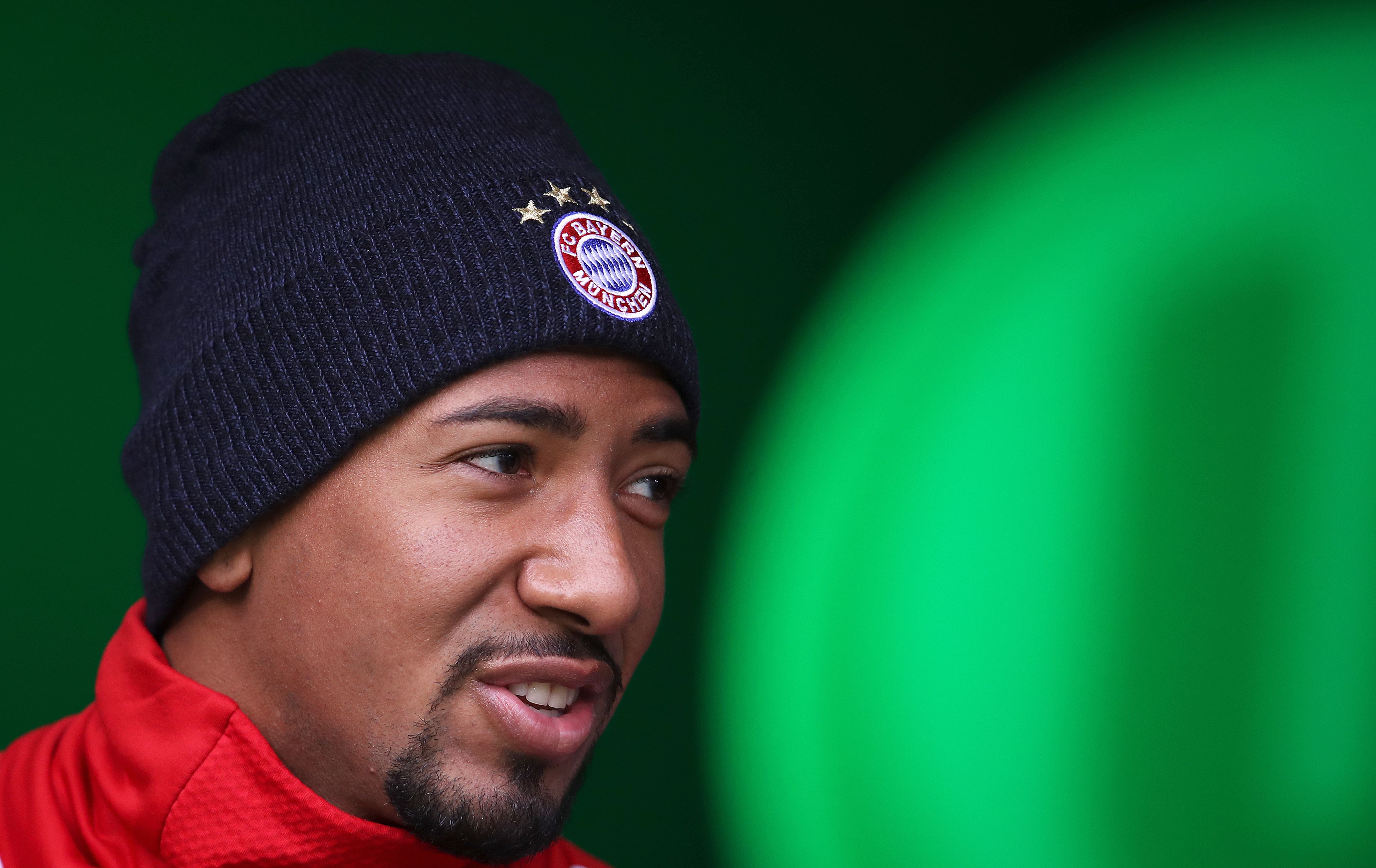 Bayern Munich's German defender Jerome Boateng enters the pitch prior to the German first division Bundesliga football match VfL Wolfsburg vs FC Bayern Munich at Volkswagen Arena on February 17, 2018 in Wolfsburg, Germany. / AFP PHOTO / Ronny Hartmann / RESTRICTIONS: DURING MATCH TIME: DFL RULES TO LIMIT THE ONLINE USAGE TO 15 PICTURES PER MATCH AND FORBID IMAGE SEQUENCES TO SIMULATE VIDEO. == RESTRICTED TO EDITORIAL USE == FOR FURTHER QUERIES PLEASE CONTACT DFL DIRECTLY AT + 49 69 650050
        (Photo credit should read RONNY HARTMANN/AFP/Getty Images)