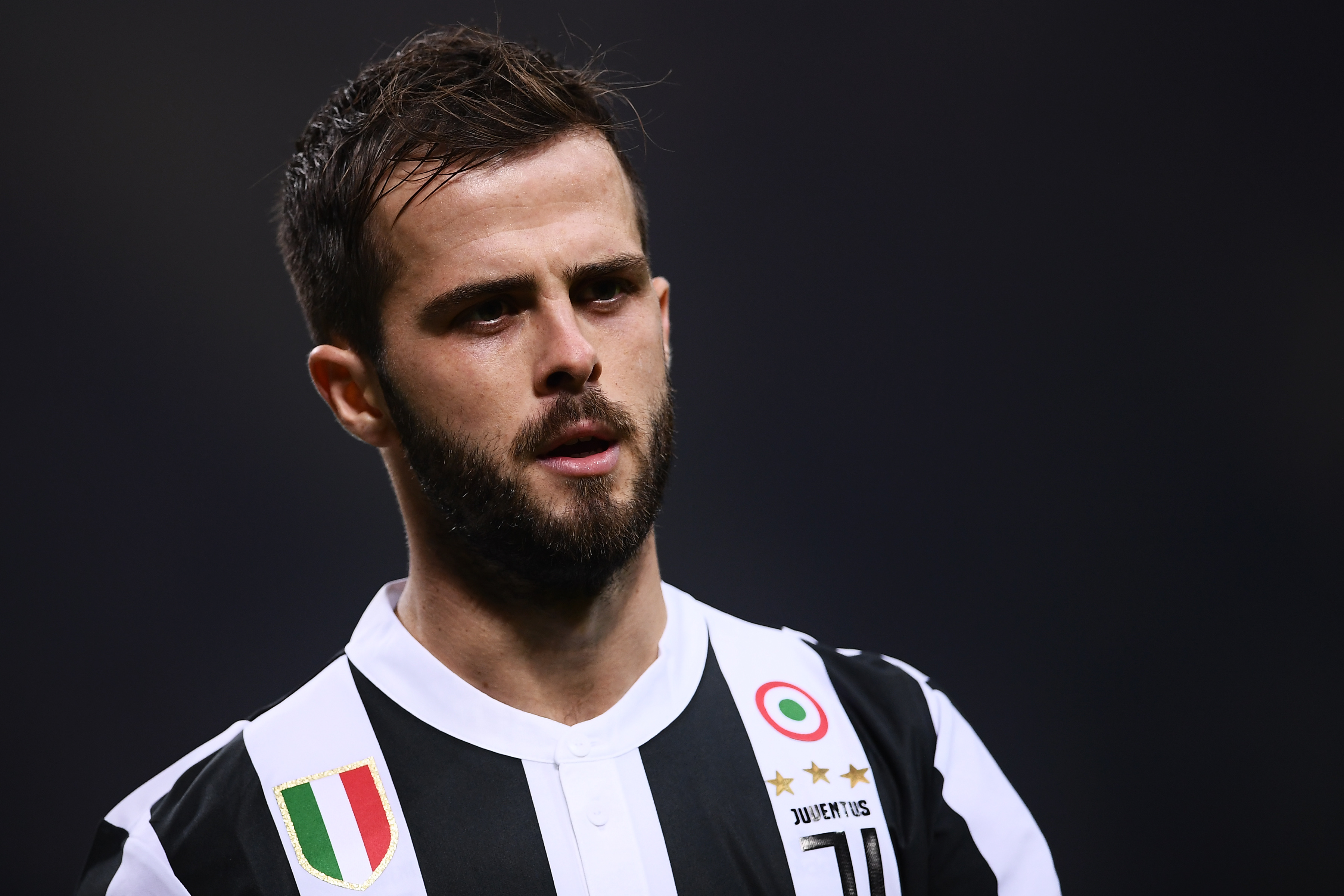 Juventus' midfielder Miralem Pjanic of Bosnia-Erzegovina looks on during the Italian Serie A football match AC Milan Vs Juventus on October 28, 2017 at the 'Giuseppe Meazza' Stadium in Milan.  / AFP PHOTO / MARCO BERTORELLO        (Photo credit should read MARCO BERTORELLO/AFP/Getty Images)