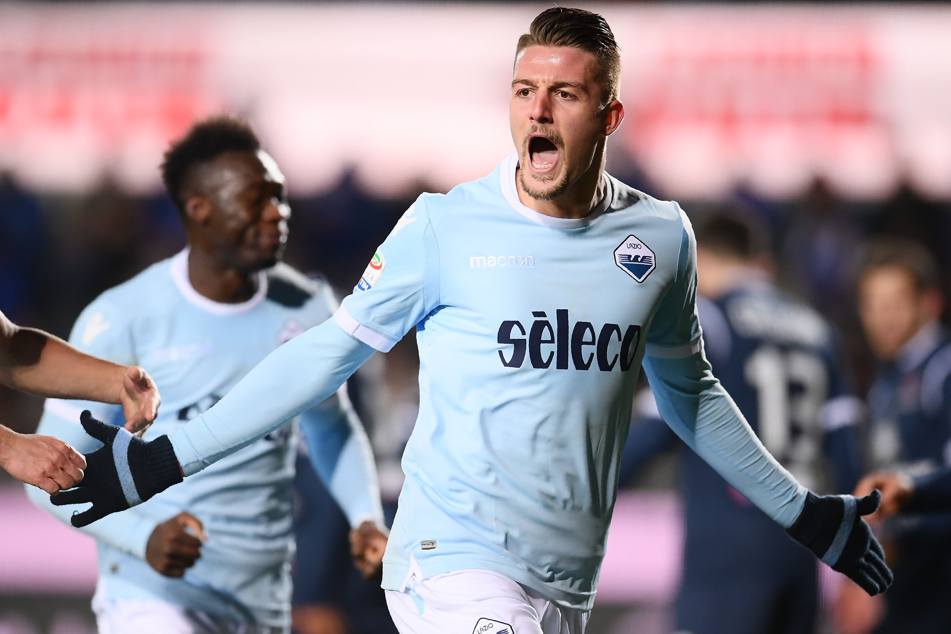 Lazio's midfielder Sergej Milinkovic-Savic from Serbia (R) celebrates after scoring during the Italian Serie A football match Atalanta vs Lazio at the 'Atleti Azzurri d'Italia' stadium in Bergamo on December 17, 2017. / AFP PHOTO / MARCO BERTORELLO        (Photo credit should read MARCO BERTORELLO/AFP/Getty Images)