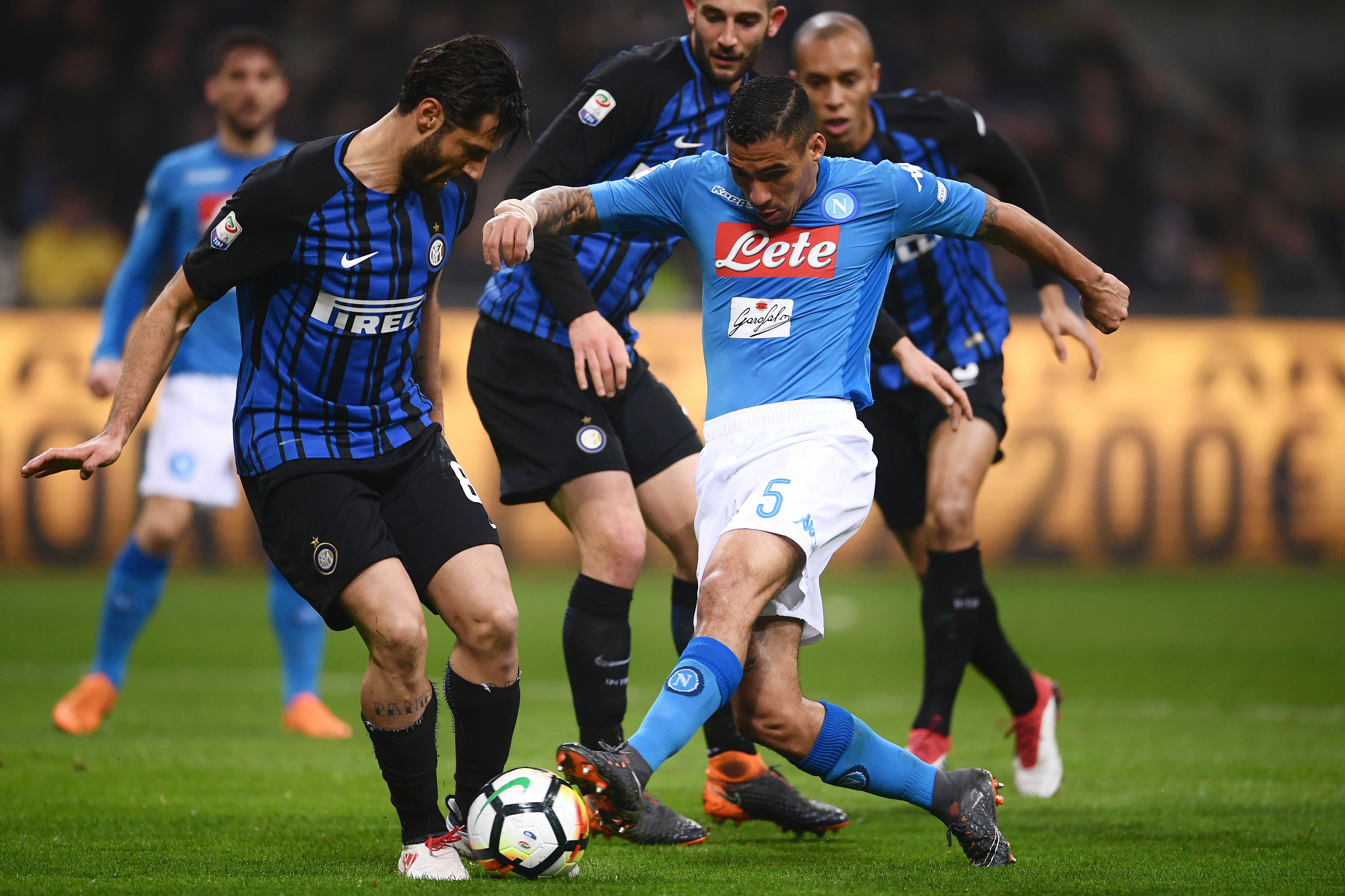 Inter Milan's defender Andrea Ranocchia from Italy (L) fights for the ball with Napoli's midfielder Allan from Brazil (C) during  the Italian Serie A football match between Inter Milan and Napoli on March 11, 2018, at the San Siro Stadium in Milan. / AFP PHOTO / MARCO BERTORELLO        (Photo credit should read MARCO BERTORELLO/AFP/Getty Images)