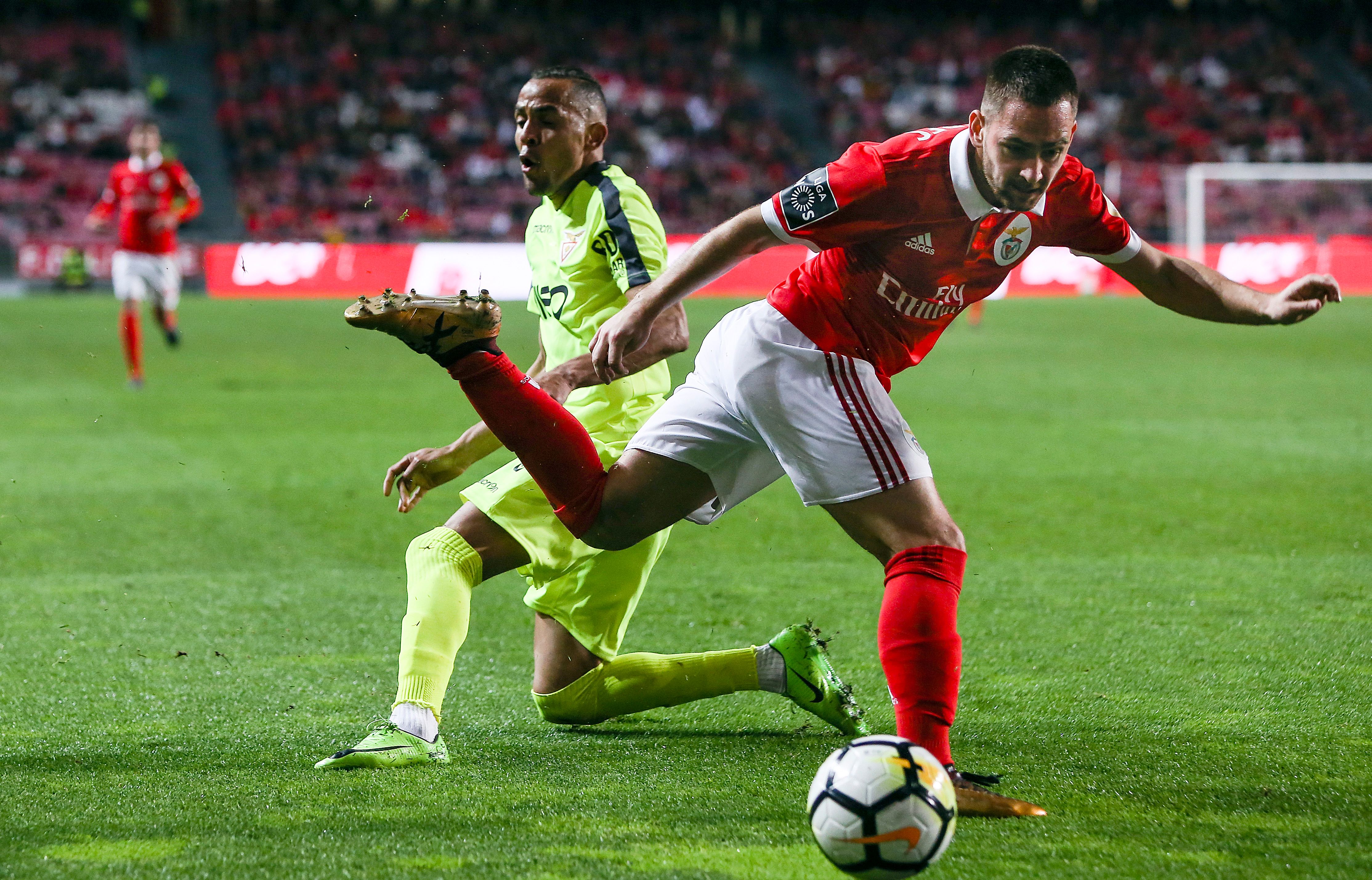 Aves' defender Nildo Petrolina (L) vies with Benfica's Serbian midfielder Andrija Zivkovic during the Portuguese league football match between SL Benfica and CD Aves at the La Luz stadium in Lisbon on March 10, 2018. / AFP PHOTO / CARLOS COSTA        (Photo credit should read CARLOS COSTA/AFP/Getty Images)