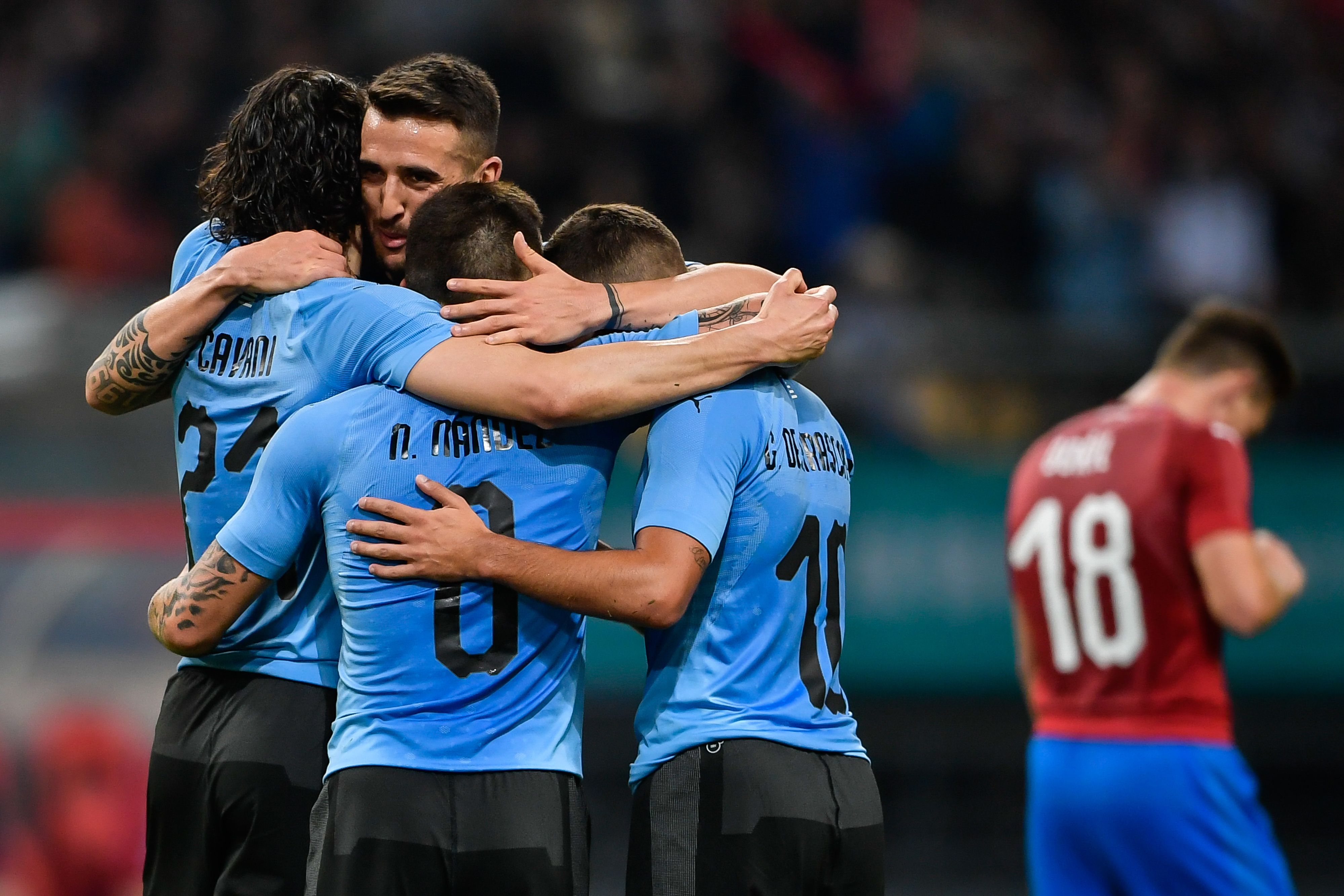 Players of Uruguay celebrate during their China Cup International Football Championship Semi-final match against Czech in Nanning in China's southern Guangxi region on March 23, 2018. / AFP PHOTO / - / China OUT        (Photo credit should read -/AFP/Getty Images)