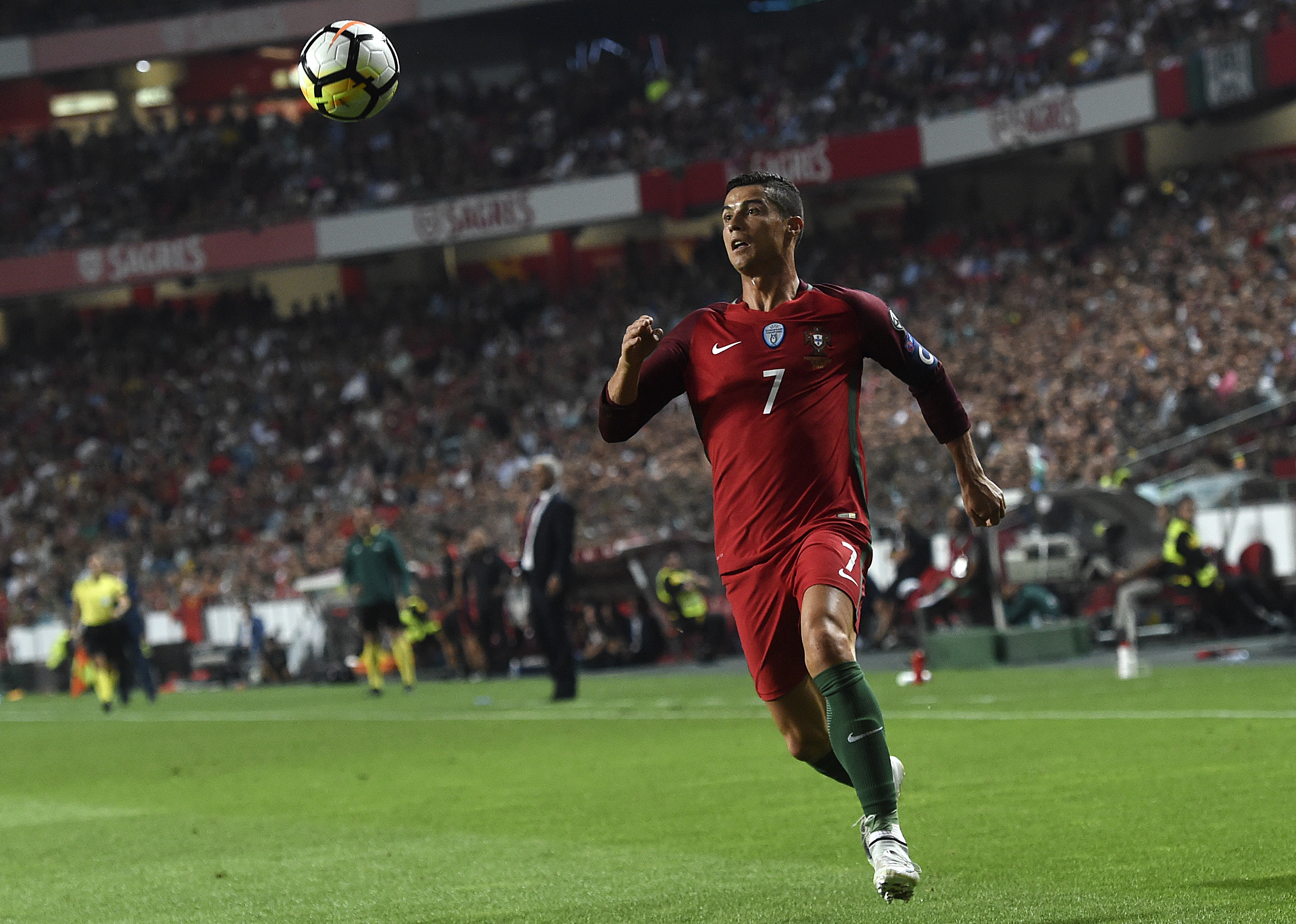 Portugal's midfielder Cristiano Ronaldo eyes the ball during the FIFA World Cup 2018 Group B qualifier football match between Portugal and Switzerland at the Luz Stadium in Lisbon on October 10, 2017. / AFP PHOTO / FRANCISCO LEONG        (Photo credit should read FRANCISCO LEONG/AFP/Getty Images)