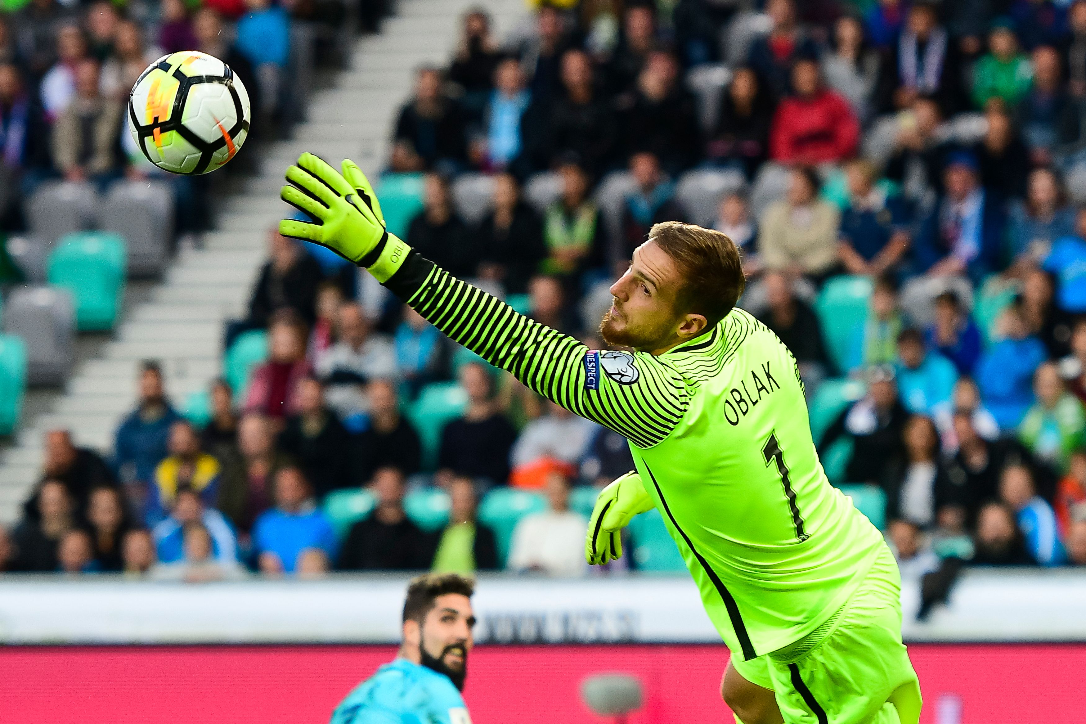 Slovenia's goalkeeper Jan Oblak goes for the save during the FIFA World Cup 2018 qualifier football match between Slovenia and Scotland at the Stozice stadium in Ljubljana, on October 8, 2017. / AFP PHOTO / Jure Makovec        (Photo credit should read JURE MAKOVEC/AFP/Getty Images)
