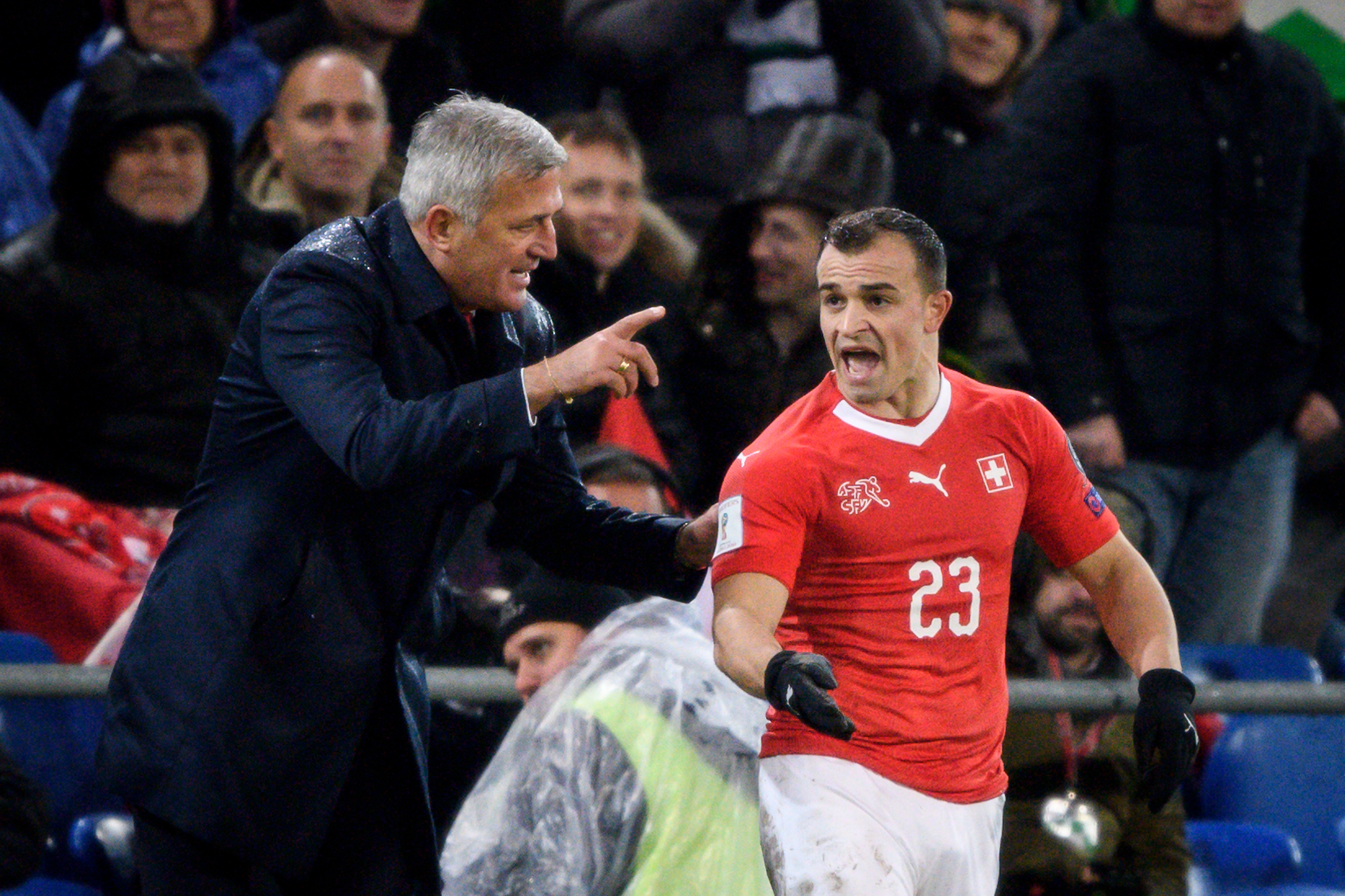 Swiss midfielder Xherdan Shaqiri (R) listens to Switzerland's head coach Vladimir Petkovic during the FIFA 2018 World Cup play-off second leg qualifying football match between Switzerland and Northern Ireland at St Jakob-Park Stadium in Basel on November 12, 2017. / AFP PHOTO / FABRICE COFFRINI        (Photo credit should read FABRICE COFFRINI/AFP/Getty Images)