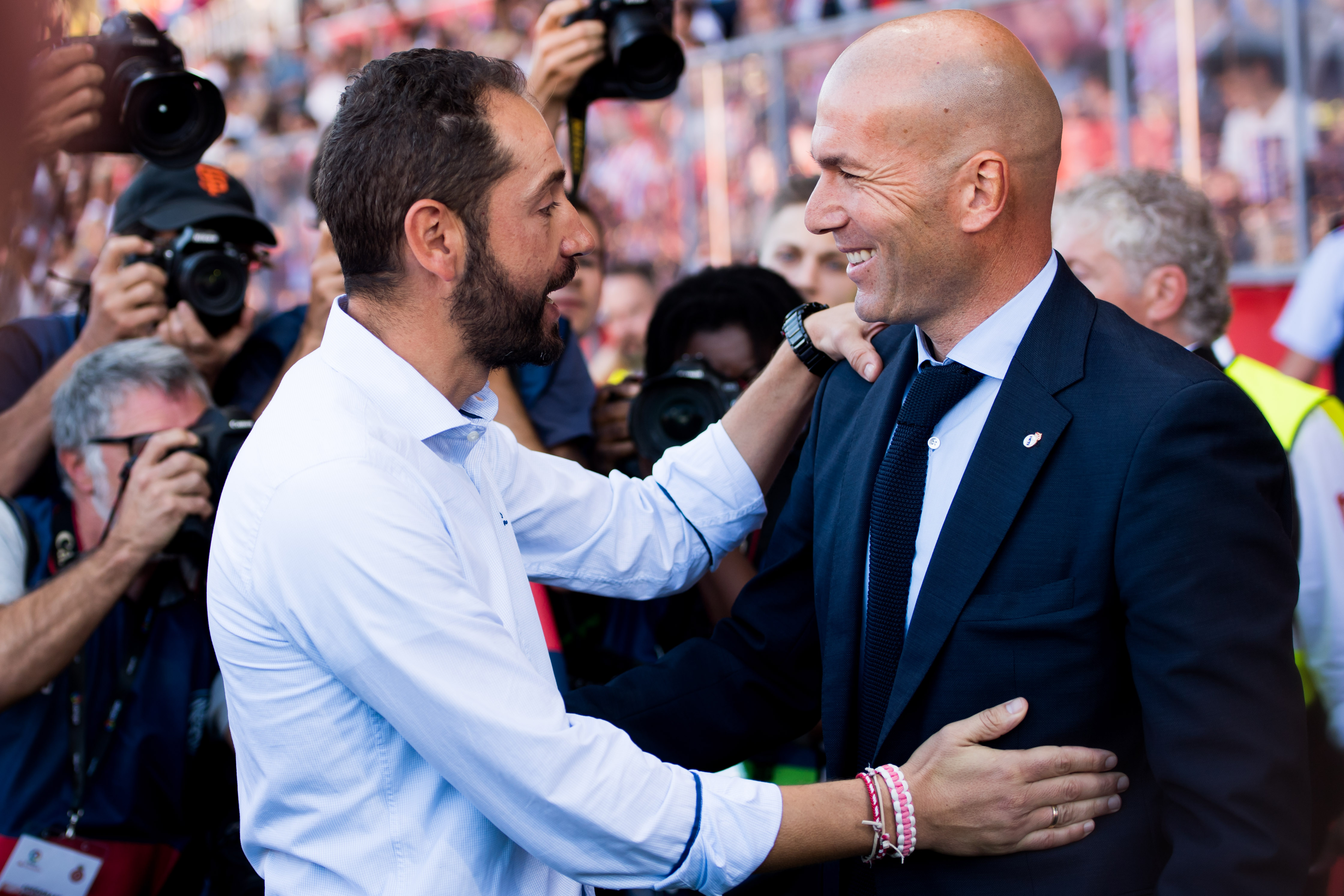 GIRONA, SPAIN - OCTOBER 29: Head Coach Pablo Machin (L) and Head Coach Zinedine Zidane meet ahead of the La Liga match between Girona and Real Madrid at Estadi de Montilivi on October 29, 2017 in Girona, Spain. (Photo by Alex Caparros/Getty Images)