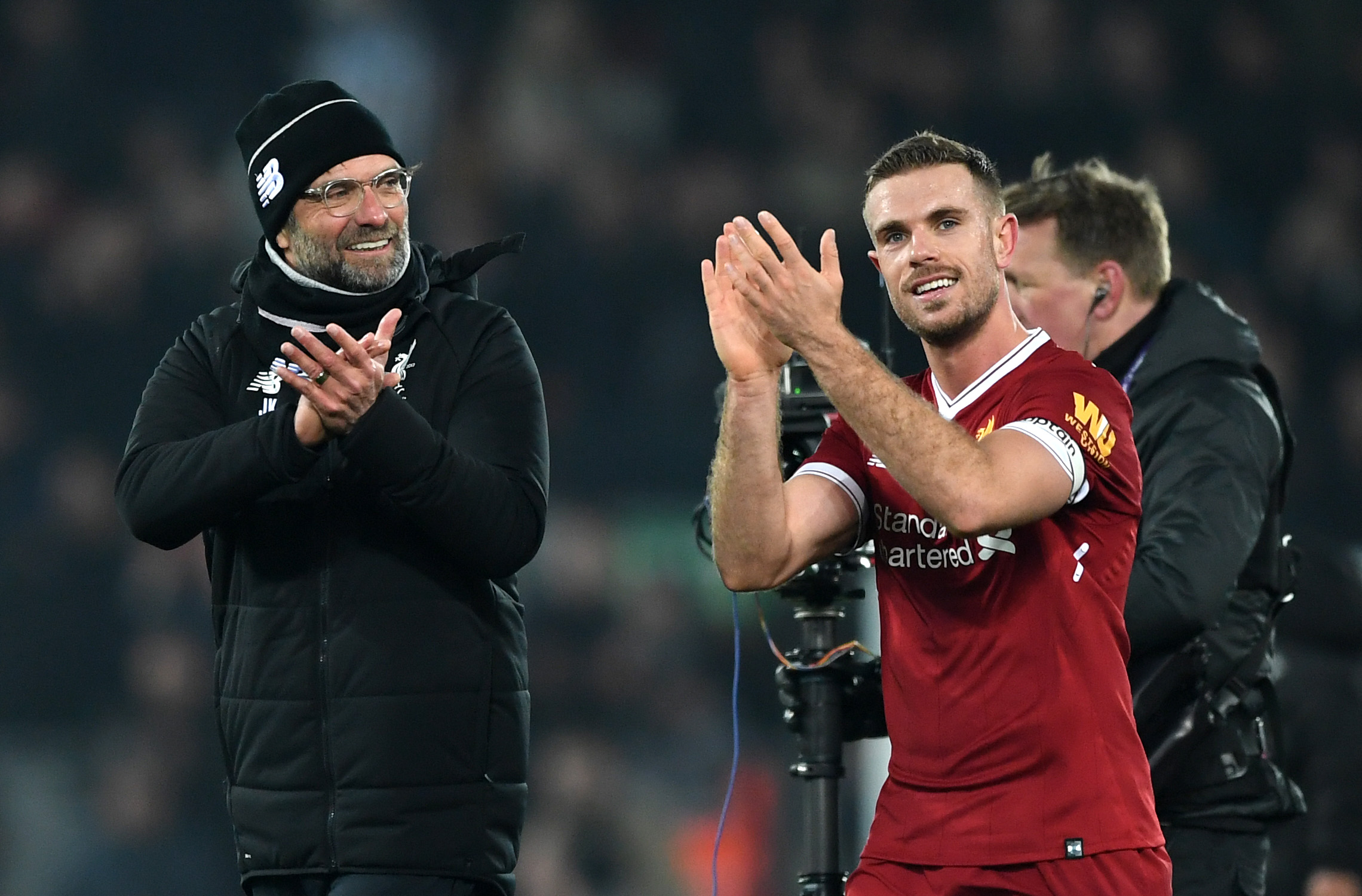LIVERPOOL, ENGLAND - MARCH 03:  Jordan Henderson of Liverpool celebrates with Jurgen Klopp, Manager of Liverpool following the Premier League match between Liverpool and Newcastle United at Anfield on March 3, 2018 in Liverpool, England.  (Photo by Gareth Copley/Getty Images)