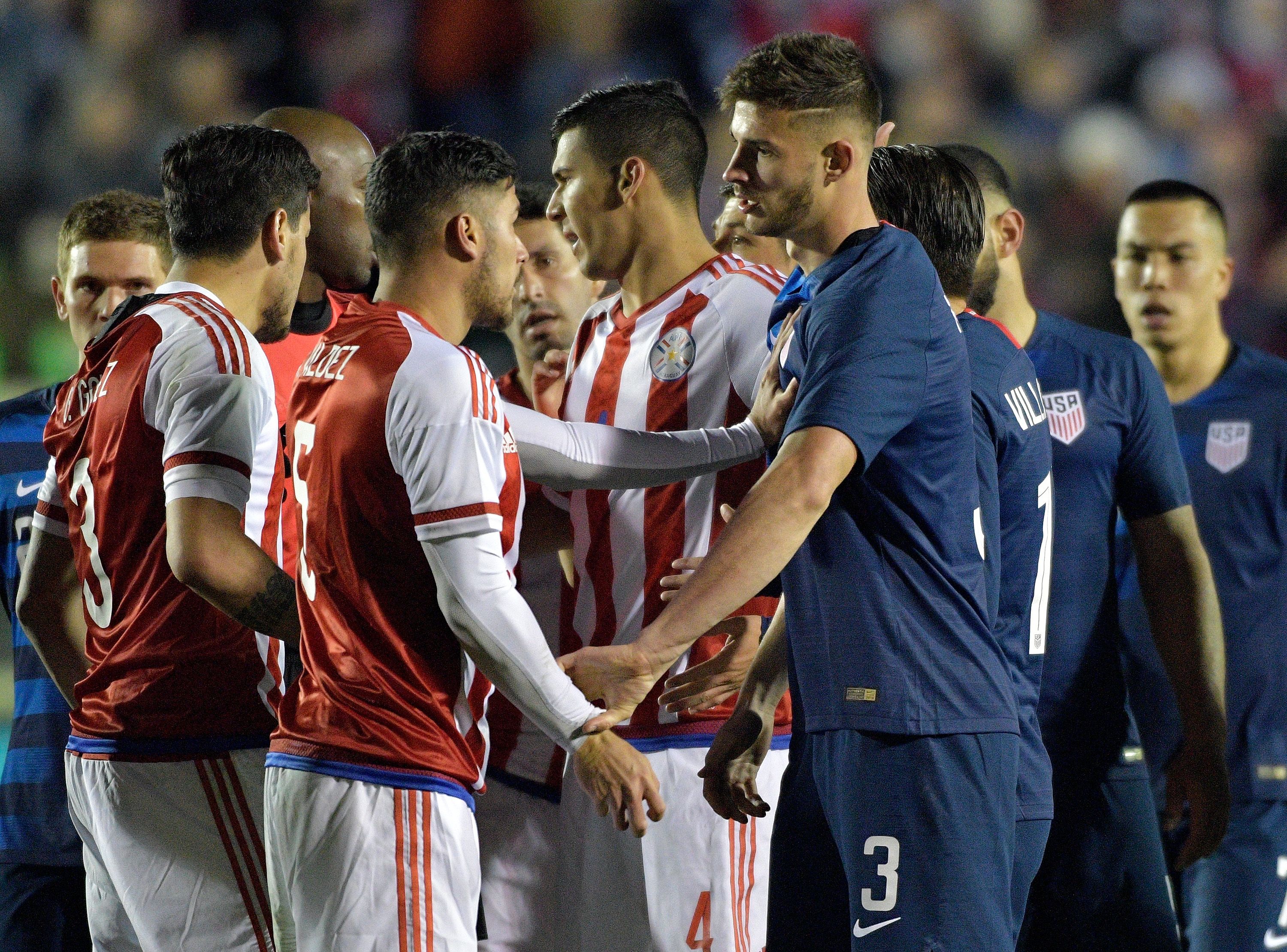 CARY, NC - MARCH 27:  Bruno Valdez #5 of Paraguay and Matt Miazga #3 of United States exchange angey words as the teams scuffle during their game at WakeMed Soccer Park on March 27, 2018 in Cary, North Carolina. The United States won 1-0.  (Photo by Grant Halverson/Getty Images)