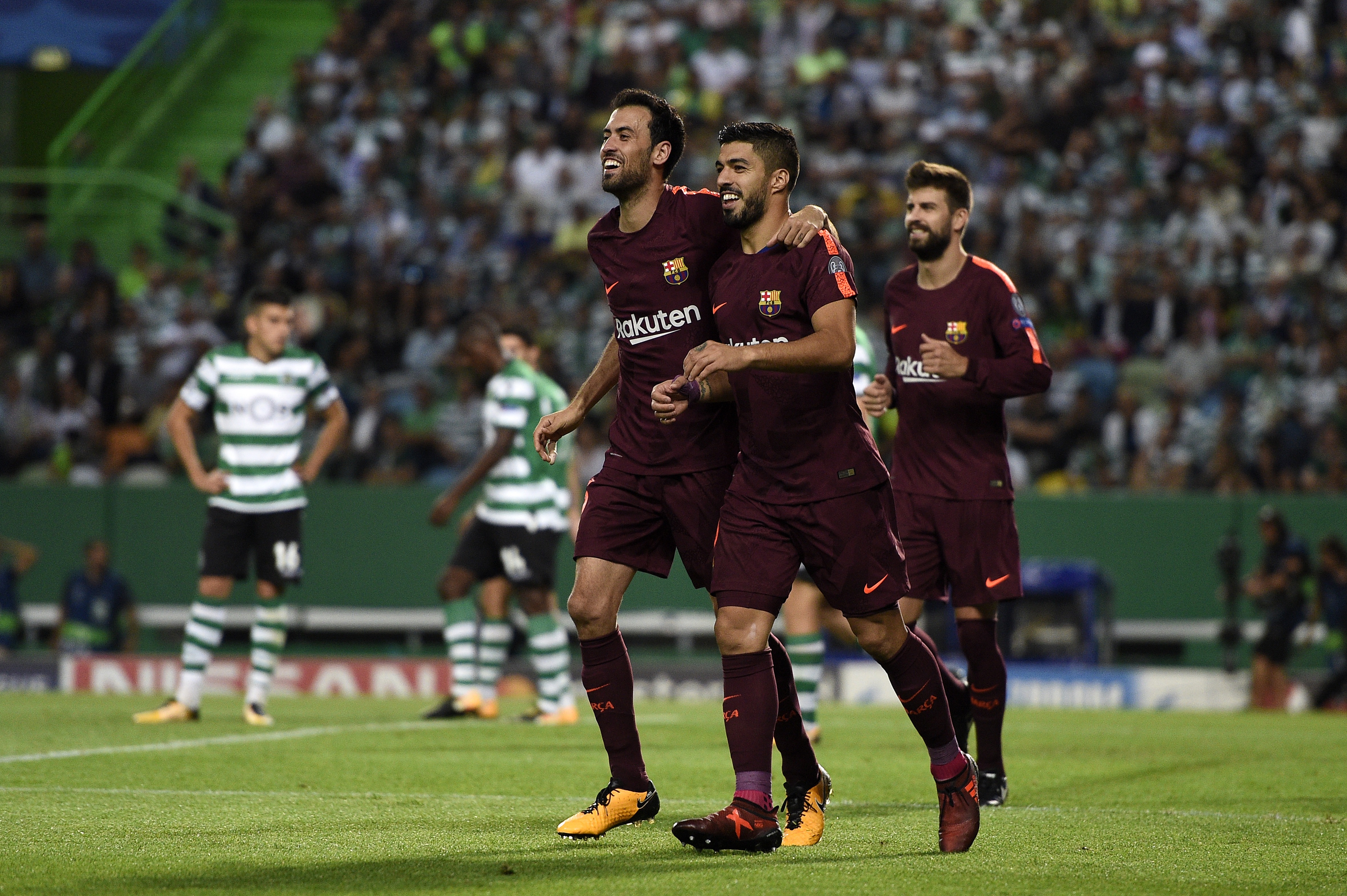 LISBON, PORTUGAL - SEPTEMBER 27: Sergio Busquets and Luis Suarez of FC Barcelona celebrates after scores the first goal during the UEFA Champions League group D match between Sporting CP and FC Barcelona at Estadio Jose Alvalade on September 27, 2017 in Lisbon, Portugal. (Photo by Octavio Passos/Getty Images)