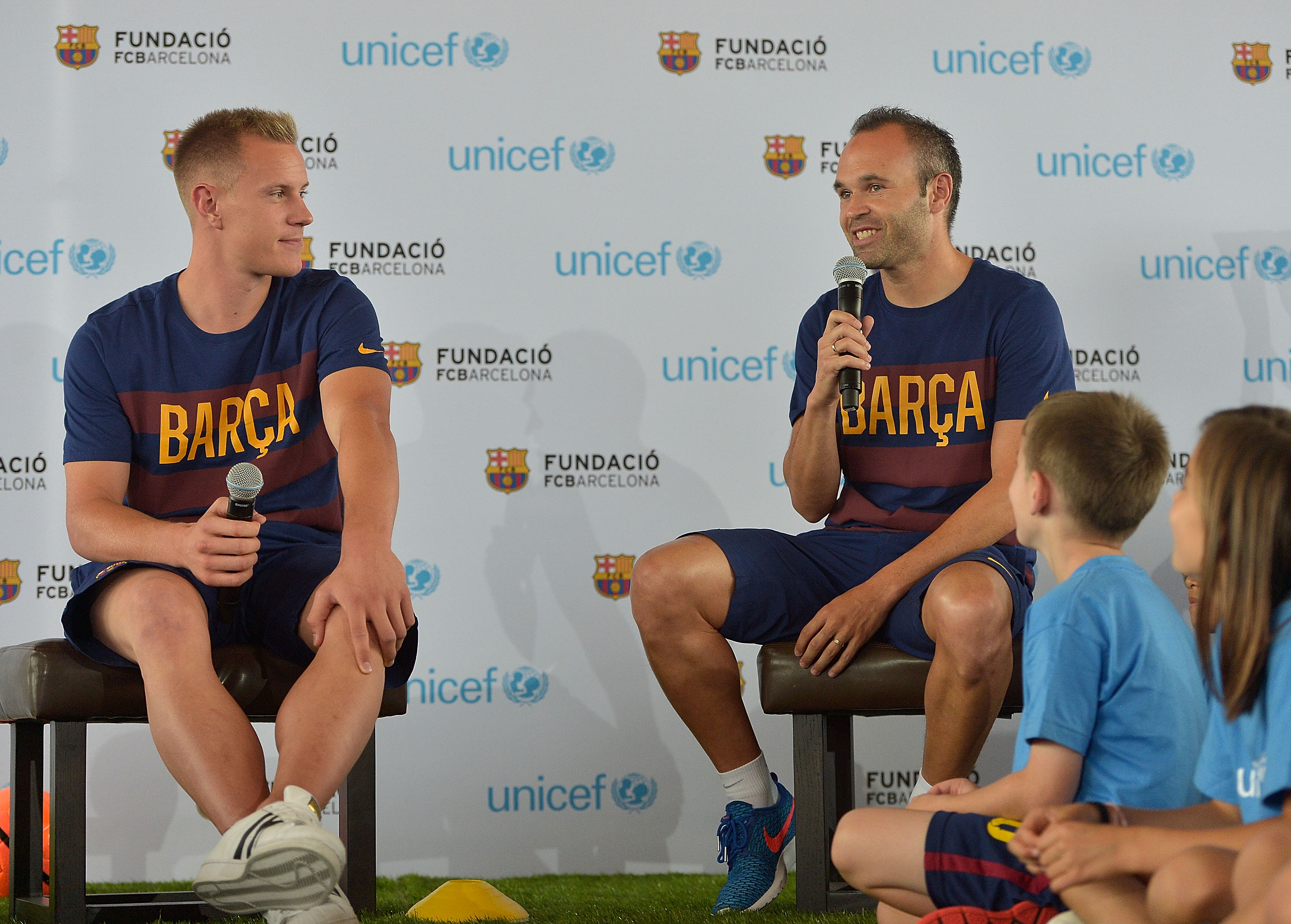 MARINA DEL REY, CA - JULY 20:  Professional soccer players Marc-Andre ter Stegen (L) and Andres Iniesta attend UNICEF And FC Barcelona Host An Event Where Children Talk About Empowering Lives Through Sport With FCB Players on July 20, 2015 in Marina del Rey, California.  (Photo by Charley Gallay/Getty Images for UNICEF)