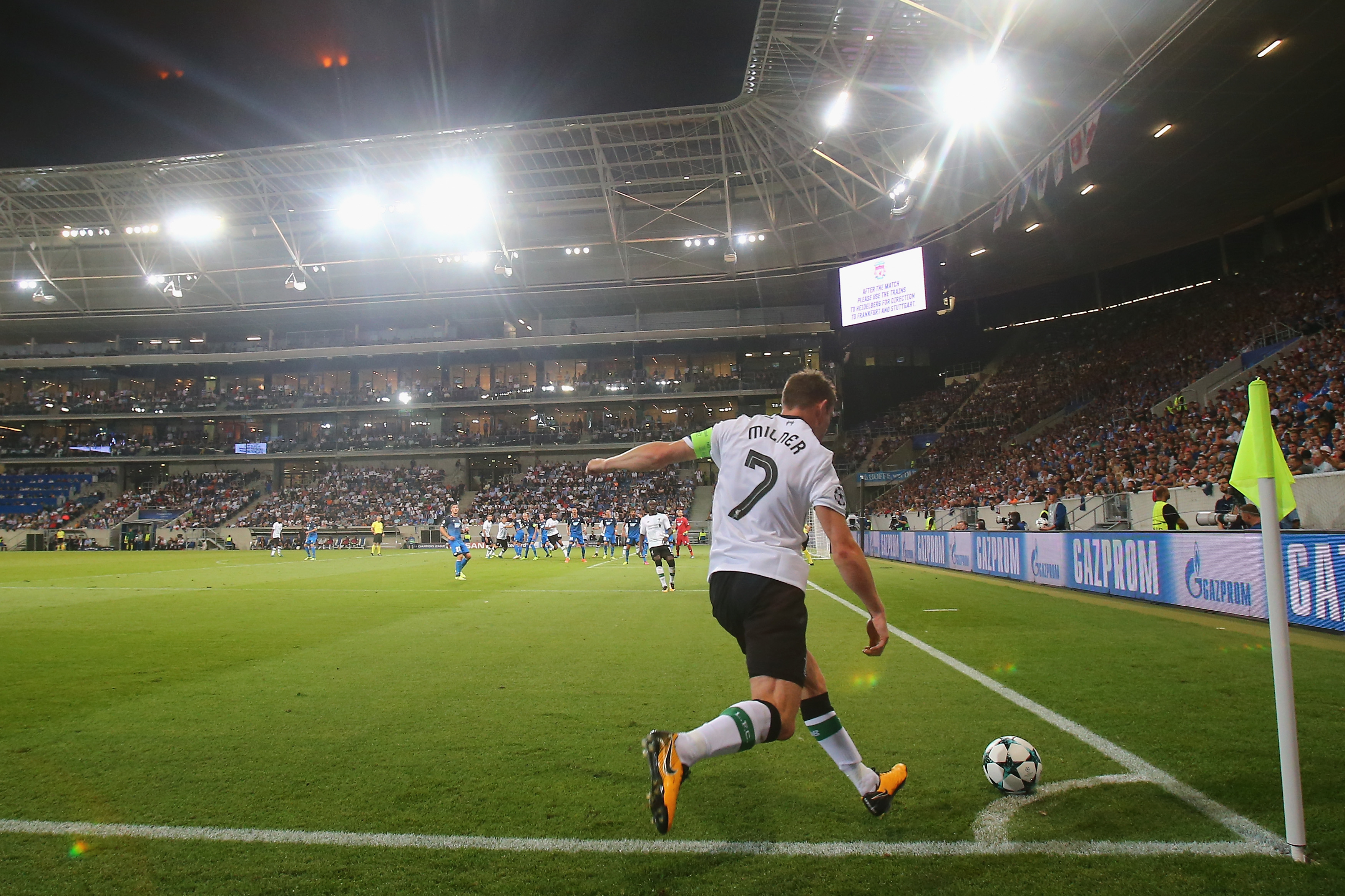 SINSHEIM, GERMANY - AUGUST 15:  James Milner of Liverpool shoots a corner during the UEFA Champions League Qualifying Play-Offs Round First Leg match between 1899 Hoffenheim and Liverpool FC at Wirsol Rhein-Neckar-Arena on August 15, 2017 in Sinsheim, Germany.  (Photo by Alex Grimm/Bongarts/Getty Images)