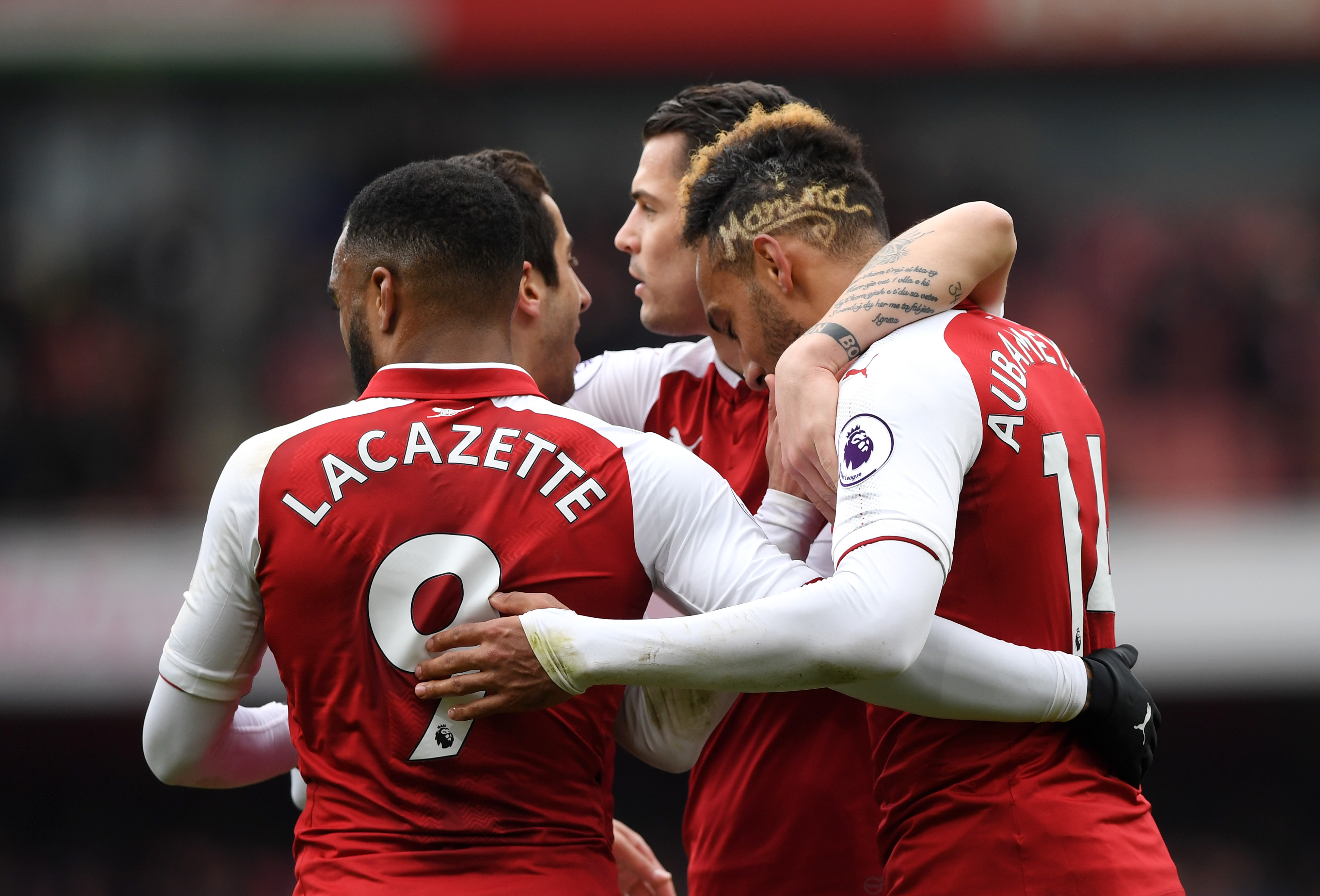 LONDON, ENGLAND - APRIL 01:  Pierre-Emerick Aubameyang of Arsenal celebrates after scoring his sides second goal with Alexandre Lacazette of Arsenal and his team mates during the Premier League match between Arsenal and Stoke City at Emirates Stadium on April 1, 2018 in London, England.  (Photo by Shaun Botterill/Getty Images)