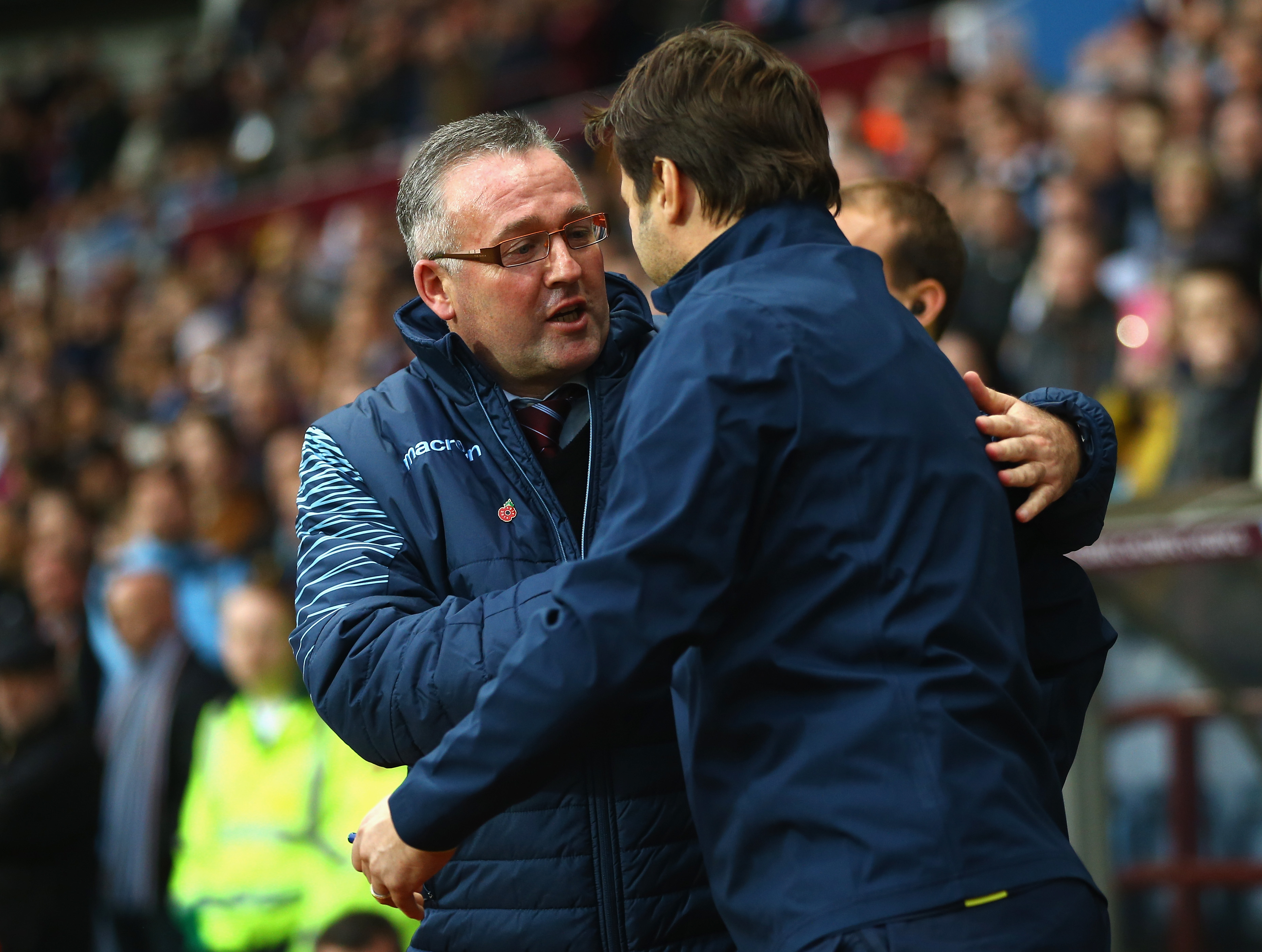 BIRMINGHAM, ENGLAND - NOVEMBER 02:  Manager Paul Lambert of Aston Villa greets Manager Mauricio Pochettino of Spurs during the Barclays Premier League match between Aston Villa and Tottenham Hotspur at Villa Park on November 2, 2014 in Birmingham, England.  (Photo by Richard Heathcote/Getty Images)