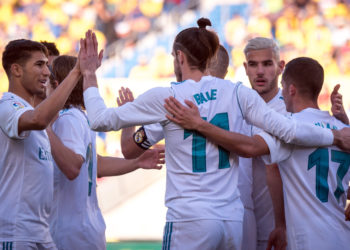 Real Madrid's Welsh forward Gareth Bale (C) celebrates a goal with teammates during the Spanish League football match between UD Las Palmas and Real Madrid CF at the Gran Canaria stadium in Las Palmas on March 31, 2018. / AFP PHOTO / DESIREE MARTIN        (Photo credit should read DESIREE MARTIN/AFP/Getty Images)