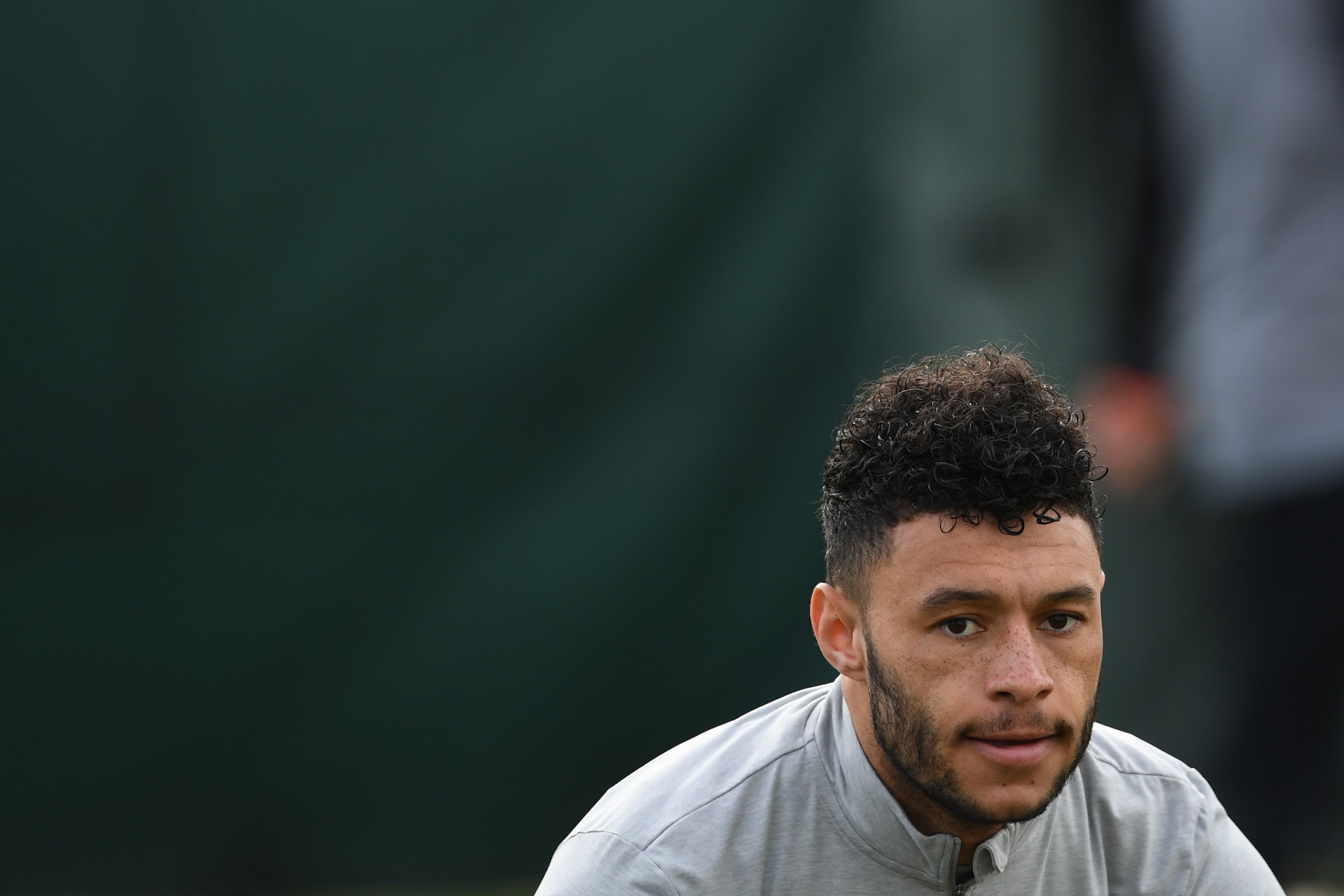Liverpool's English midfielder Alex Oxlade-Chamberlain attends a team training session on the eve of the UEFA Champions League first leg quarter-final football match between Liverpool and Manchester City, at Melwood Training Ground in Liverpool, north west England on April 3, 2018. / AFP PHOTO / Paul ELLIS        (Photo credit should read PAUL ELLIS/AFP/Getty Images)