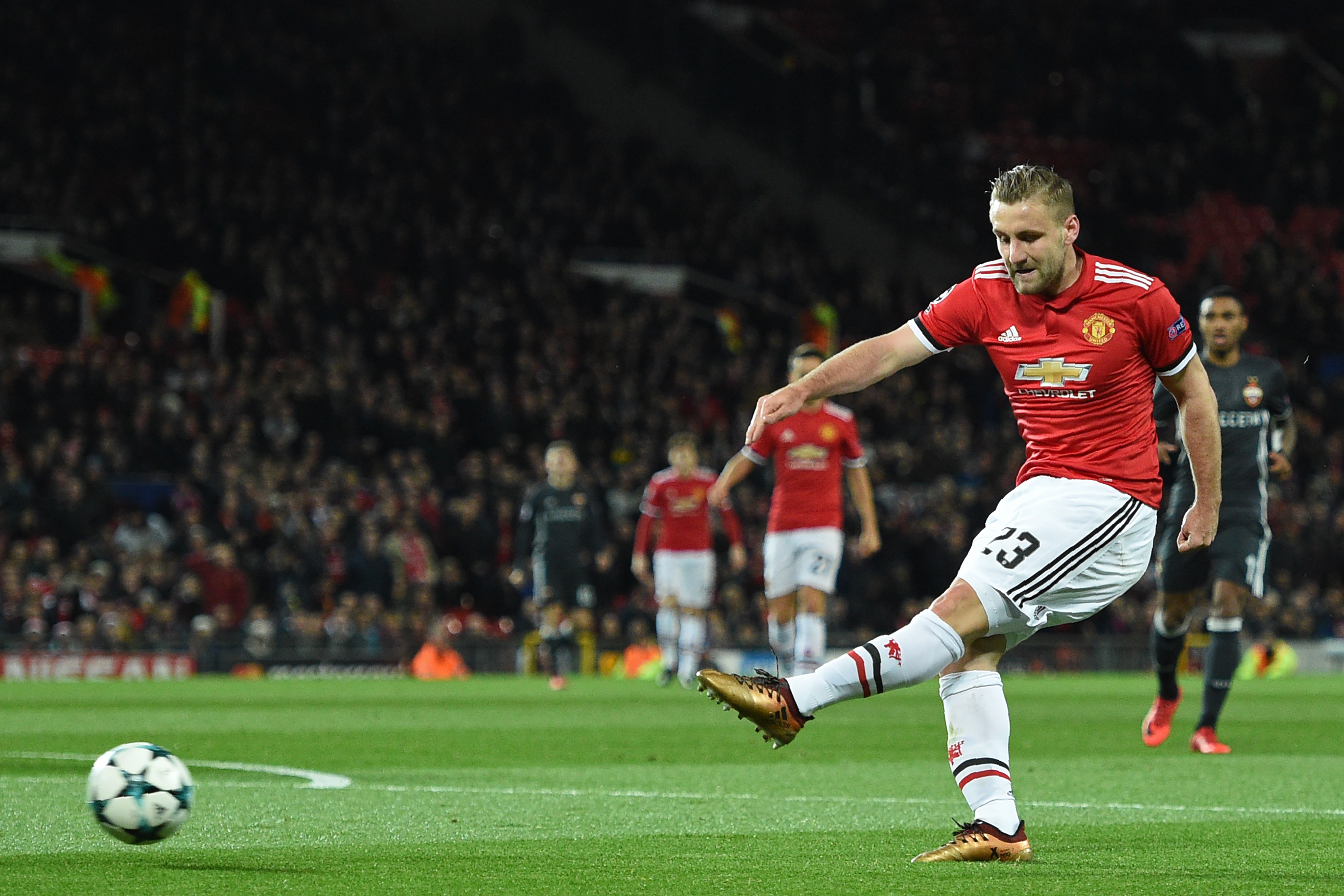 Manchester United's English defender Luke Shaw has an unsuccessful shot during the UEFA Champions League Group A football match between Manchester United and CSKA Moscow at Old Trafford in Manchester, north west England on December 5, 2017. / AFP PHOTO / Oli SCARFF        (Photo credit should read OLI SCARFF/AFP/Getty Images)