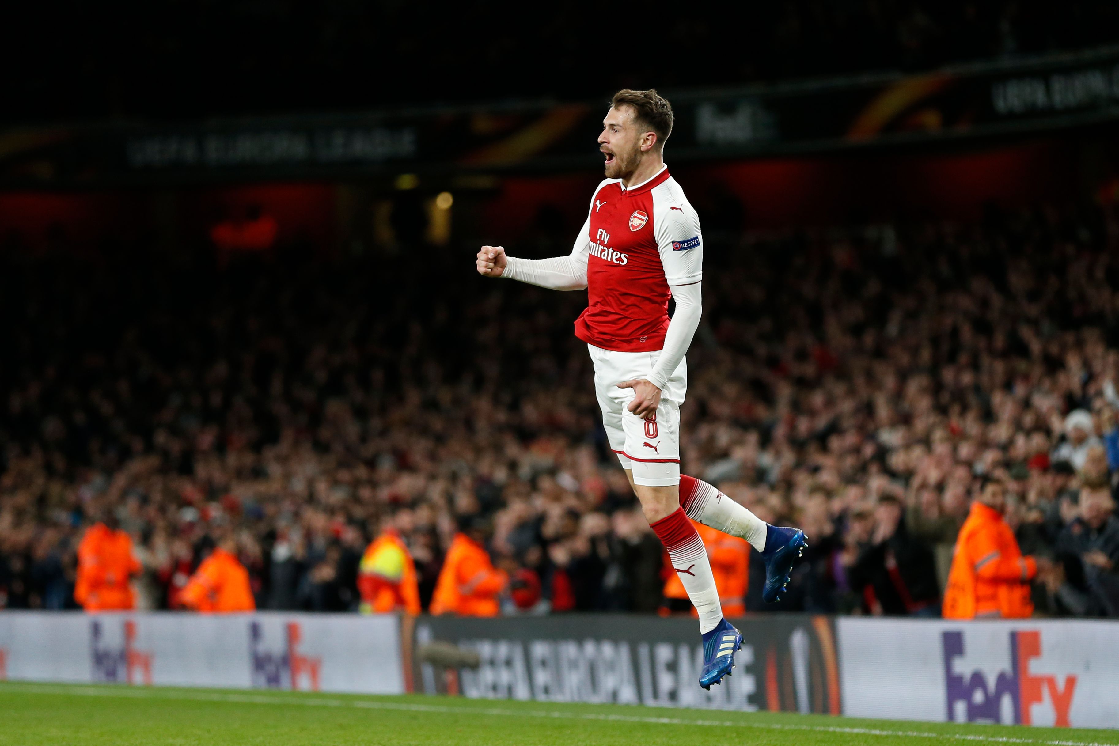 Arsenal's Welsh midfielder Aaron Ramsey celebrates after scoring their third goal during the UEFA Europa League first leg quarter-final football match  between Arsenal and CSKA Moscow at the Emirates Stadium in London on April 5, 2018.  / AFP PHOTO / IKIMAGES / Ian KINGTON        (Photo credit should read IAN KINGTON/AFP/Getty Images)