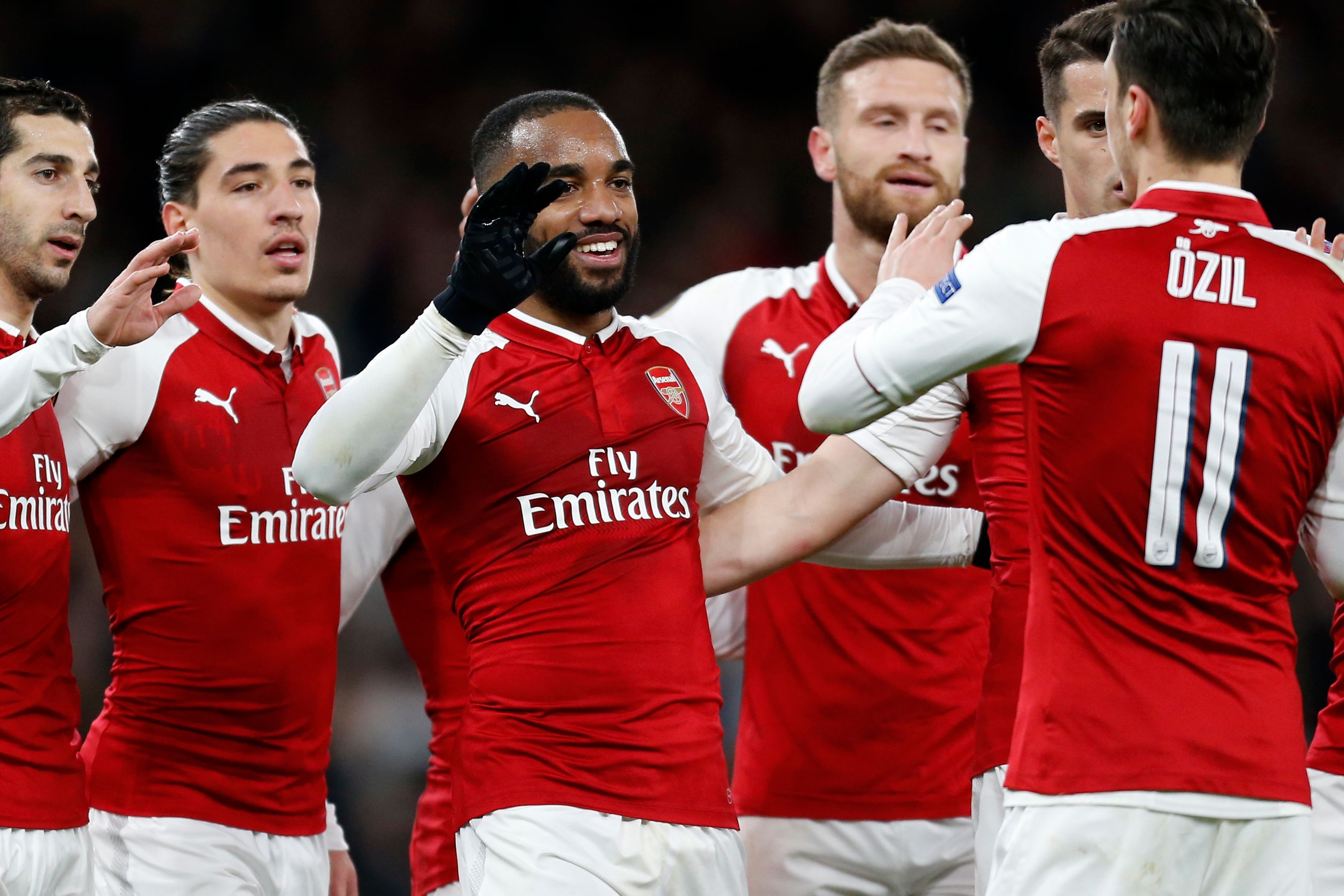 Arsenal's French striker Alexandre Lacazette (C) celebrates with teammates after scoring their fourth goal during the UEFA Europa League first leg quarter-final football match  between Arsenal and CSKA Moscow at the Emirates Stadium in London on April 5, 2018.  / AFP PHOTO / IKIMAGES / Ian KINGTON        (Photo credit should read IAN KINGTON/AFP/Getty Images)