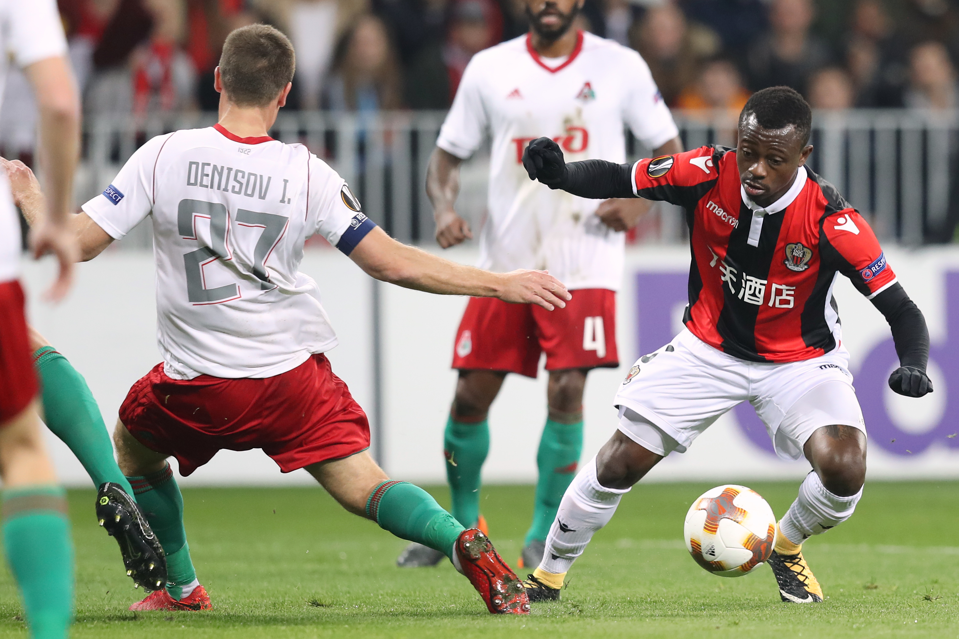 Nice's Ivorian midfielder Jean Michael Seri (R) vies with Lokomotiv Igor Denisov (L) during the UEFA Europa League football match between Nice and Lokomotiv Moscow on February 15, 2018, at the Allianz Riviera stadium in Nice, southeastern France.   / AFP PHOTO / VALERY HACHE        (Photo credit should read VALERY HACHE/AFP/Getty Images)