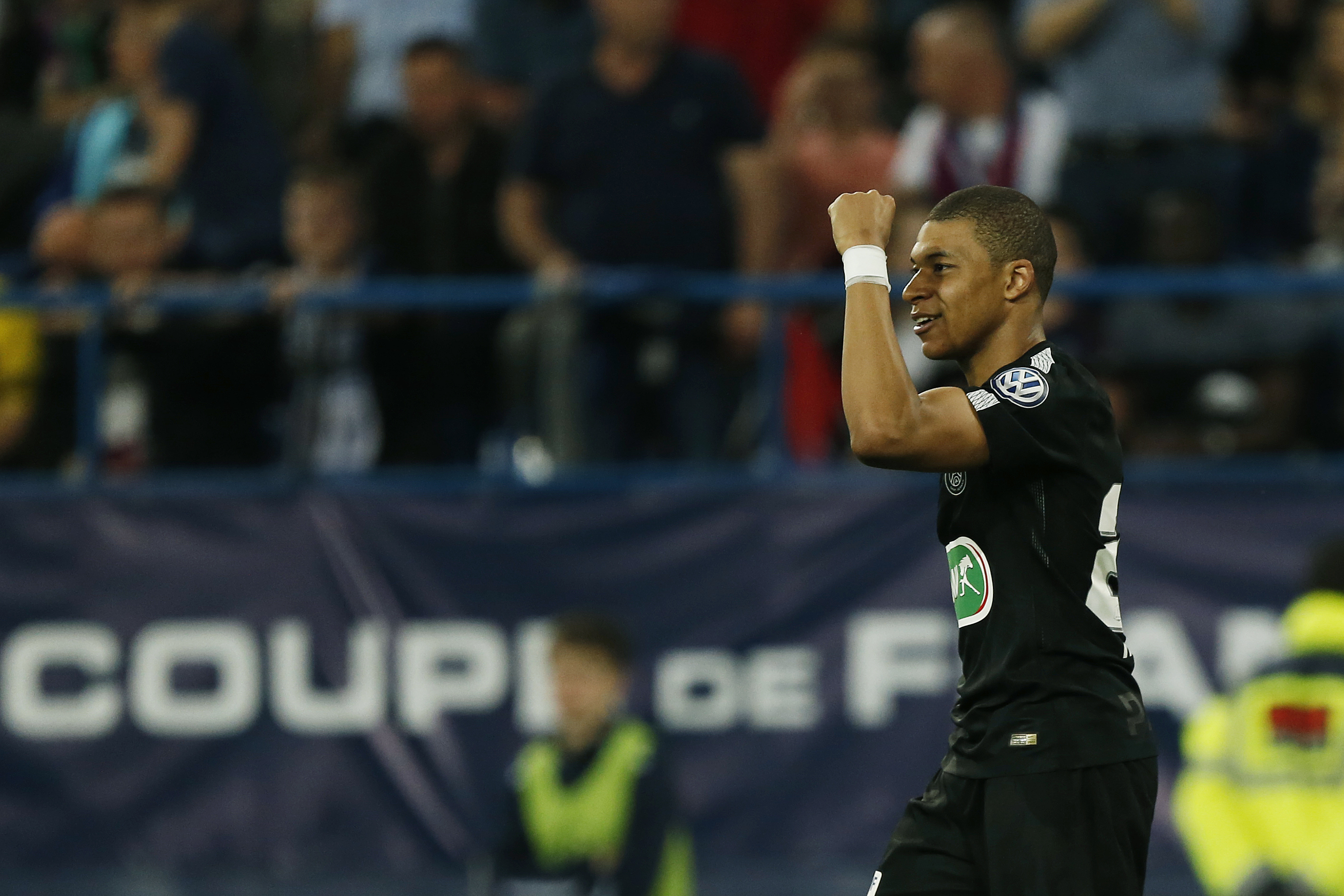 Paris Saint-Germain's French forward Kylian Mbappe reacts after scoring during the French cup semi-final match between Caen (SMC) and Paris Saint-Germain (PSG) on April 18, 2018 at the Michel-d'Ornano stadium in Caen, northwestern France. / AFP PHOTO / CHARLY TRIBALLEAU        (Photo credit should read CHARLY TRIBALLEAU/AFP/Getty Images)