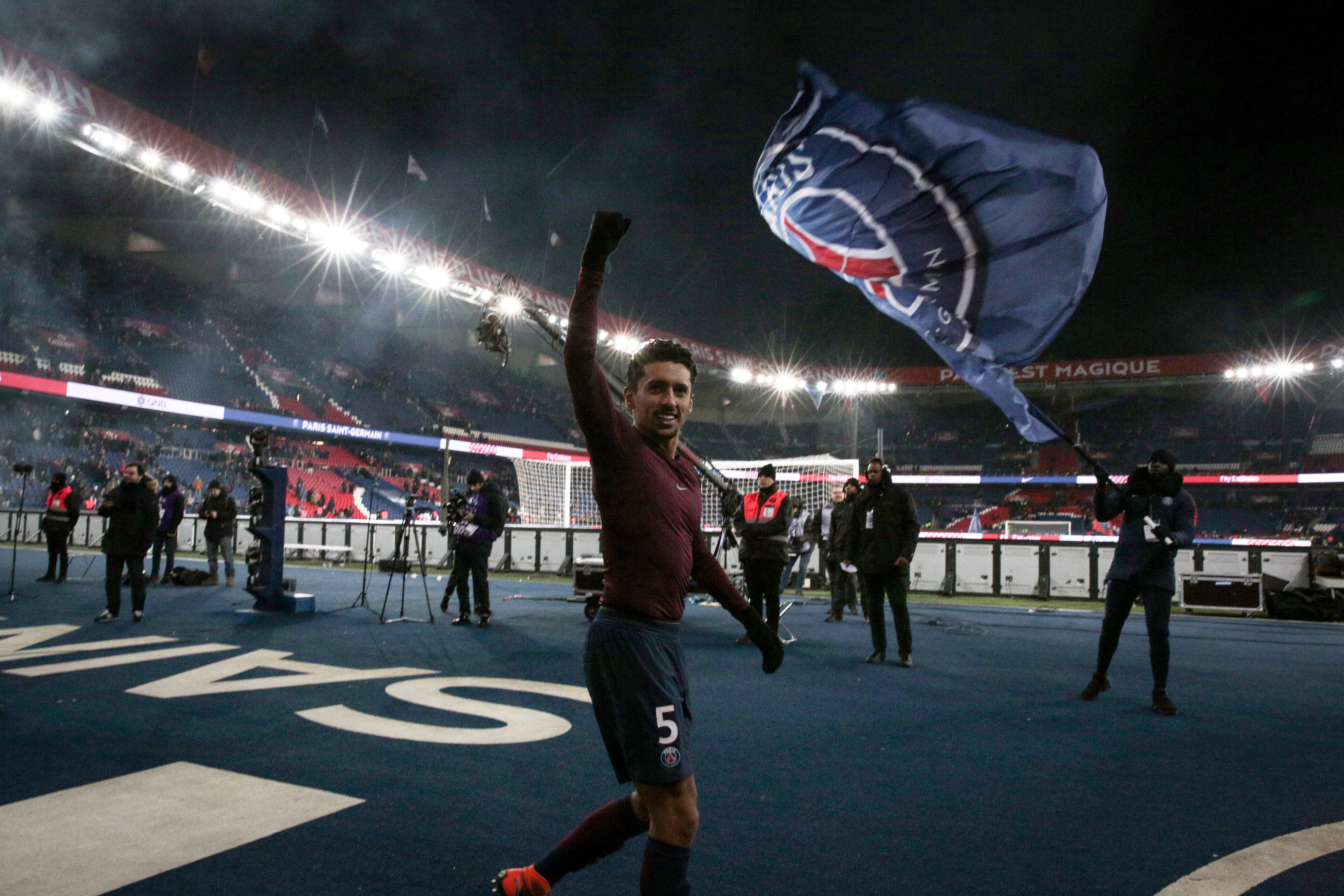 Paris Saint-Germain's Brazilian defender Marquinhos celebrates after the team won the French L1 football match between Paris Saint-Germain (PSG) and Marseille (OM) at the Parc des Princes in Paris on February 25, 2018.  / AFP PHOTO / GEOFFROY VAN DER HASSELT        (Photo credit should read GEOFFROY VAN DER HASSELT/AFP/Getty Images)