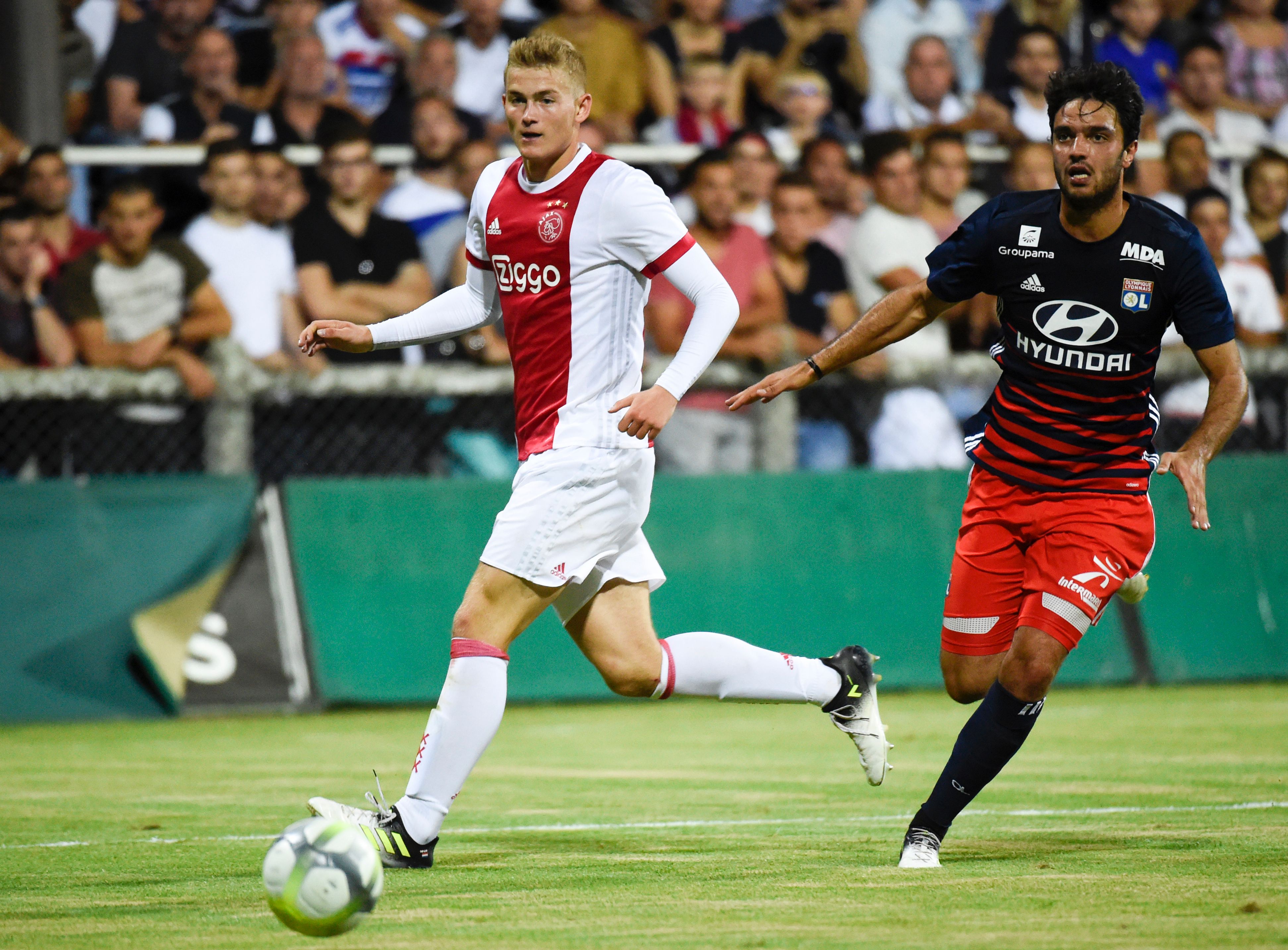 Ajax defender Matthijs de Ligt (L) vies with Lyon's French midfielder Clement Grenier during a friendly football match between Olympique Lyonnais and Ajax Amsterdam on July 18, 2017 at the Pierre Rajon stadium in Bourgoin-Jallieu.  / AFP PHOTO / JEAN-PHILIPPE KSIAZEK        (Photo credit should read JEAN-PHILIPPE KSIAZEK/AFP/Getty Images)