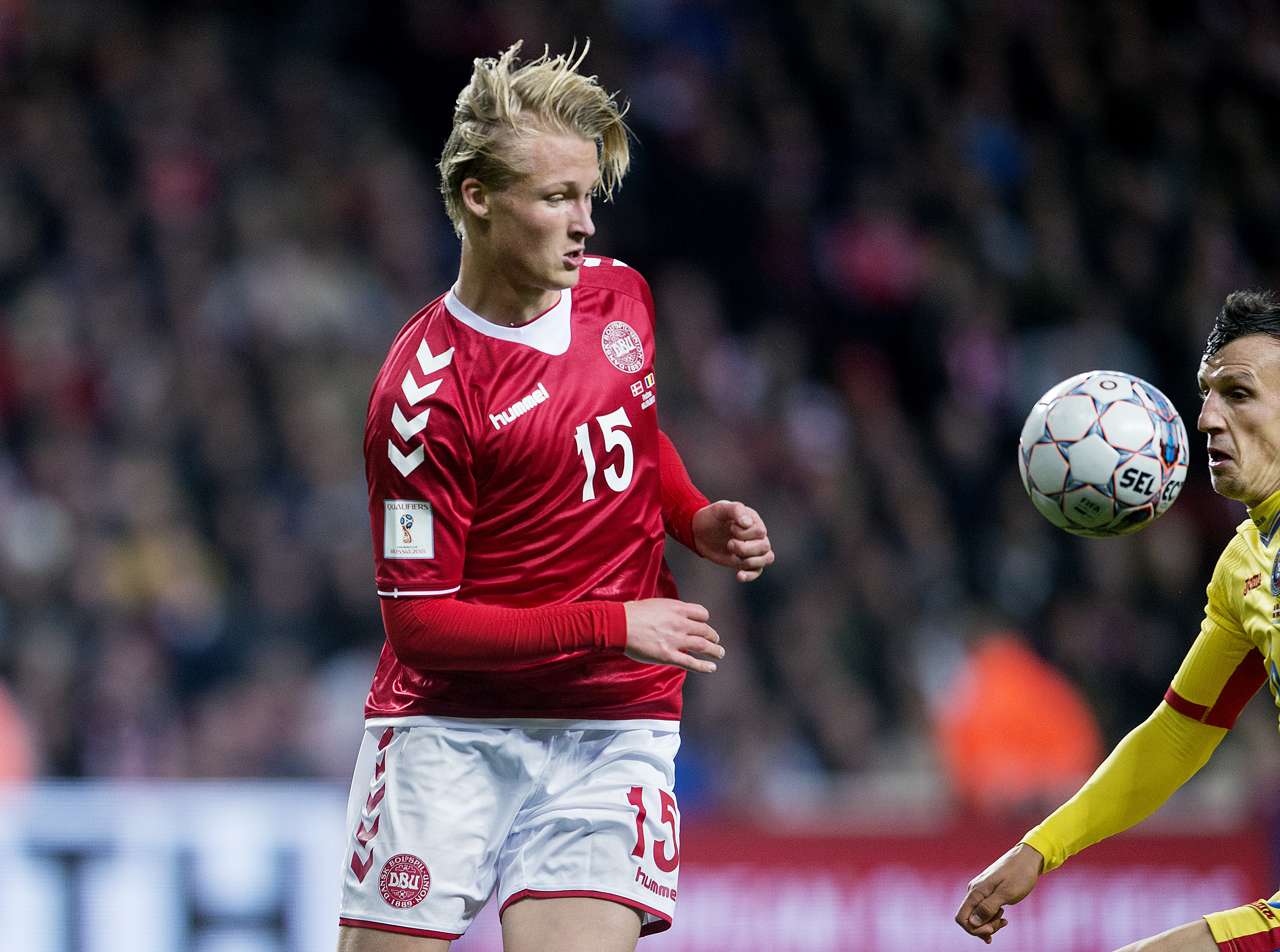 Denmark's forward Kasper Dolberg vies with Romania's Vlad Chiriches during the FIFA World Cup 2018 qualification football match between Denmark and Romania in Copenhagen on October 8, 2017. / AFP PHOTO / Scanpix Denmark AND Scanpix / Liselotte Sabroe / Denmark OUT        (Photo credit should read LISELOTTE SABROE/AFP/Getty Images)