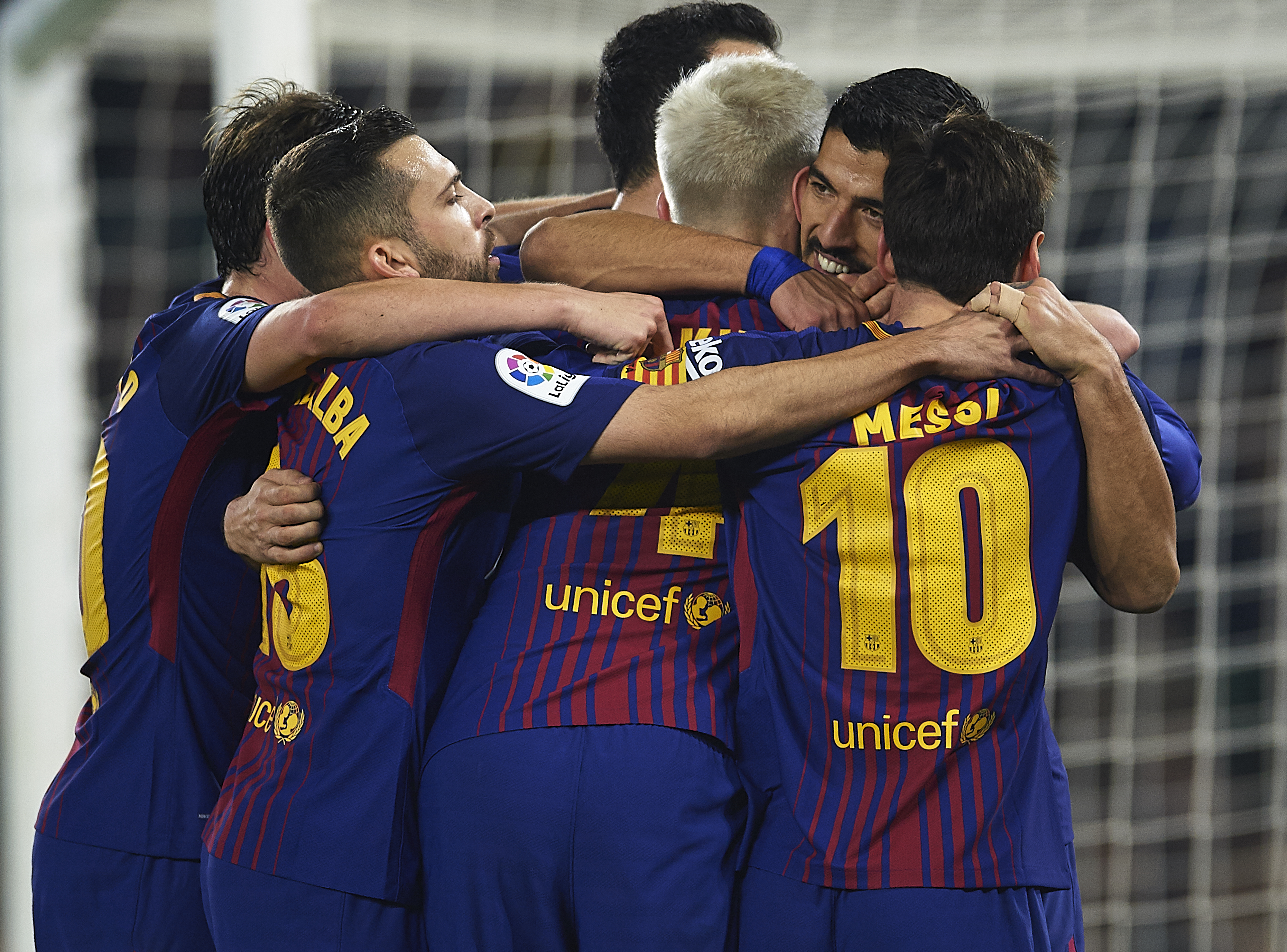 SEVILLE, SPAIN - JANUARY 21:  Luis Suarez of FC Barcelona  celebrates after scoring the third goal for FC Barcelona with his team mates during the La Liga match between Real Betis and Barcelona at Estadio Benito Villamarin on January 21, 2018 in Seville, .  (Photo by Aitor Alcalde/Getty Images)
