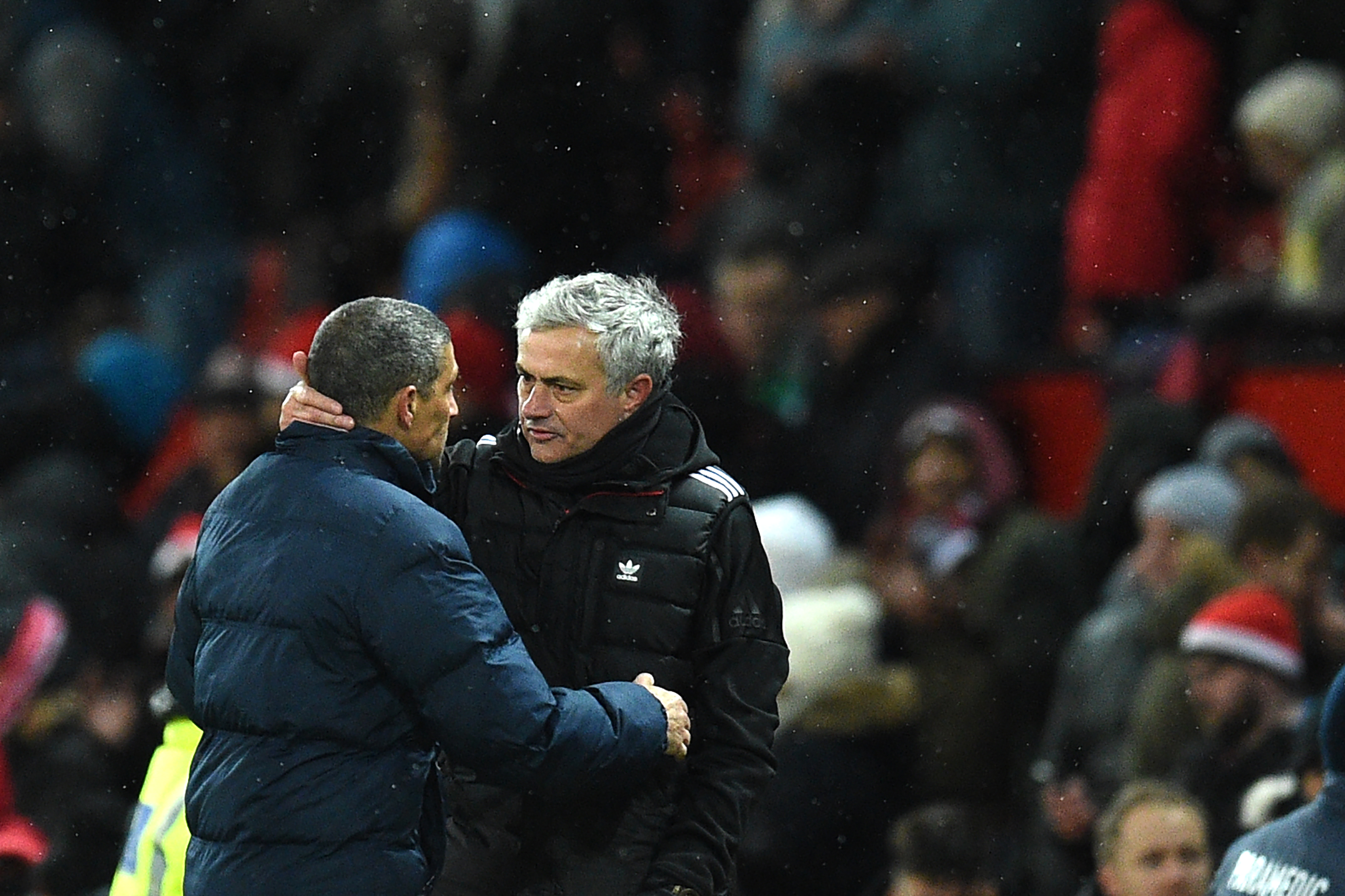 Brighton's Irish manager Chris Hughton (L) greets Manchester United's Portuguese manager Jose Mourinho after the English FA Cup quarter-final football match between Manchester United and Brighton and Hove Albion at Old Trafford in Manchester, north west England, on March 17, 2018. / AFP PHOTO / Oli SCARFF / RESTRICTED TO EDITORIAL USE. No use with unauthorized audio, video, data, fixture lists, club/league logos or 'live' services. Online in-match use limited to 75 images, no video emulation. No use in betting, games or single club/league/player publications.  / The erroneous mention[s] appearing in the metadata of this photo by Oli SCARFF                           has been modified in AFP systems in the following manner: [Brighton's Irish manager Chris Hughton] instead of [Brighton and Hove Albion manager Javi Gracia]. Please immediately remove the erroneous mention[s] from all your online services and delete it (them) from your servers. If you have been authorized by AFP to distribute it (them) to third parties, please ensure that the same actions are carried out by them. Failure to promptly comply with these instructions will entail liability on your part for any continued or post notification usage. Therefore we thank you very much for all your attention and prompt action. We are sorry for the inconvenience this notification may cause and remain at your disposal for any further information you may require.        (Photo credit should read OLI SCARFF/AFP/Getty Images)