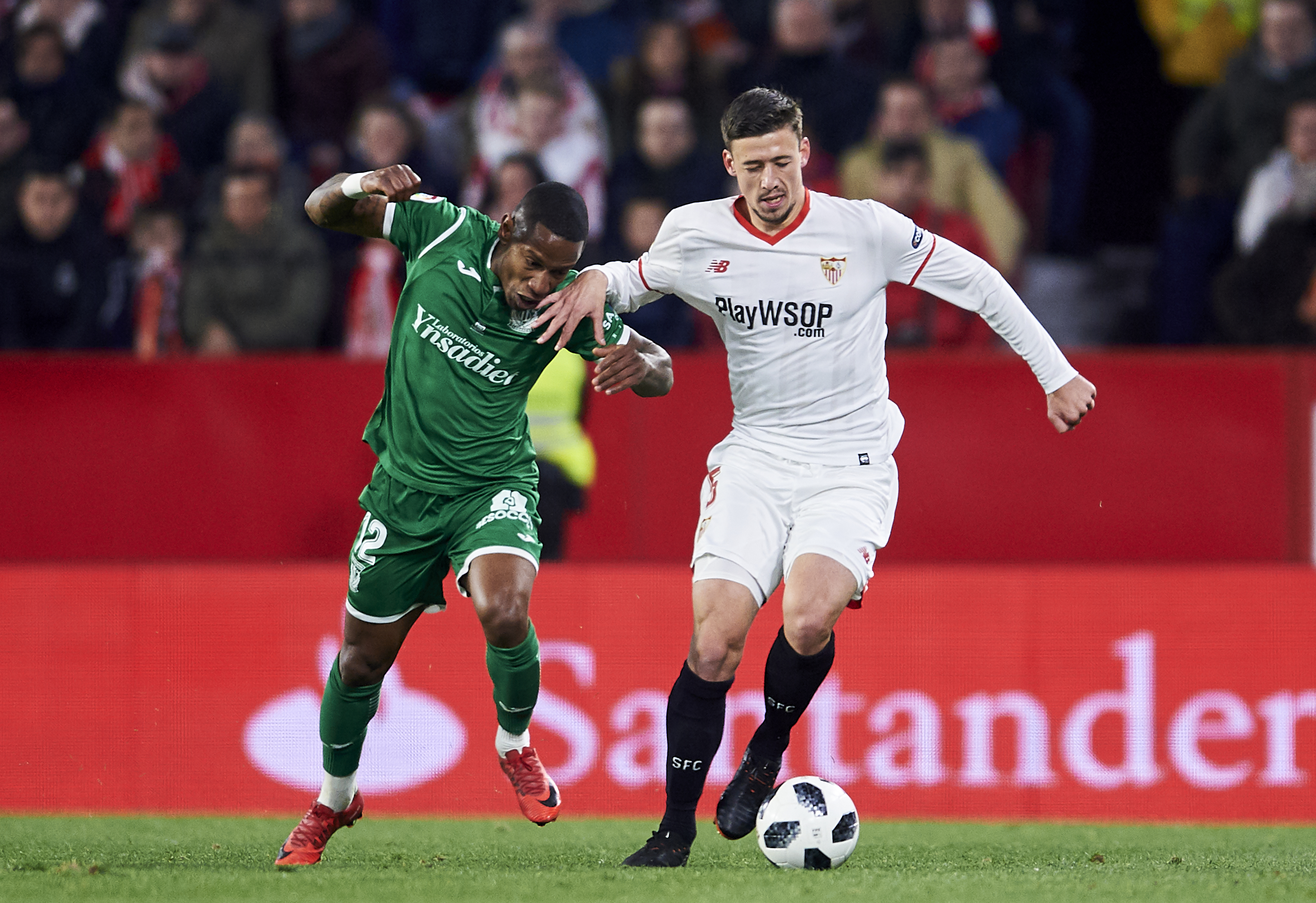 SEVILLE, SPAIN - FEBRUARY 07: Claudio Beauvue  of Leganes competes for the ball with Clement Lenglet of Sevilla during the Copa del Rey semi-final second leg match between Sevilla FC and CD Leganes at Estadio Ramon Sanchez Pizjuan on February 7, 2018 in Seville, Spain.  (Photo by Aitor Alcalde/Getty Images)