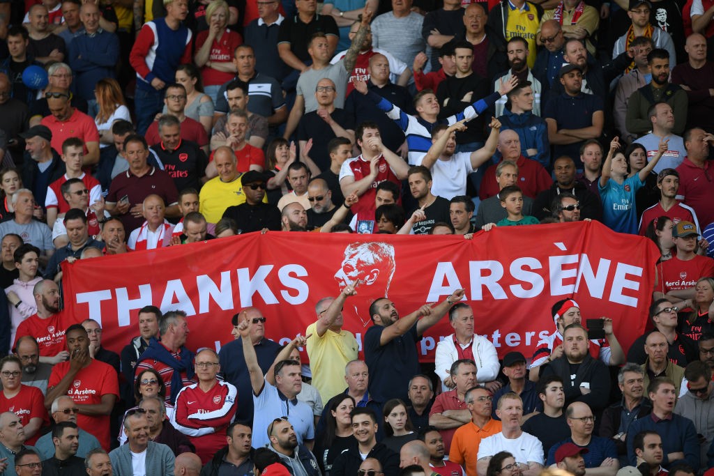 HUDDERSFIELD, ENGLAND - MAY 13: Fans hold up signs celebrating Arsene Wenger after the Premier League match between Huddersfield Town and Arsenal at John Smith's Stadium on May 13, 2018 in Huddersfield, England. (Photo by Shaun Botterill/Getty Images)