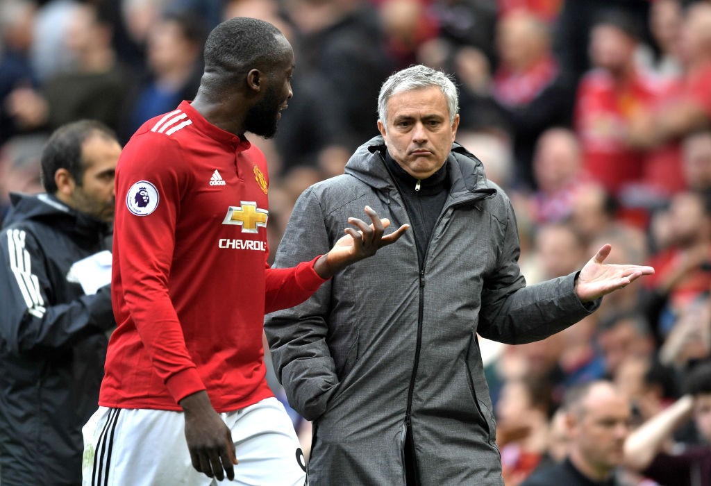 MANCHESTER, ENGLAND - MARCH 10: Romelu Lukaku of Manchester United speaks with Jose Mourinho during the Premier League match between Manchester United and Liverpool at Old Trafford on March 10, 2018 in Manchester, England. (Photo by Michael Regan/Getty Images)